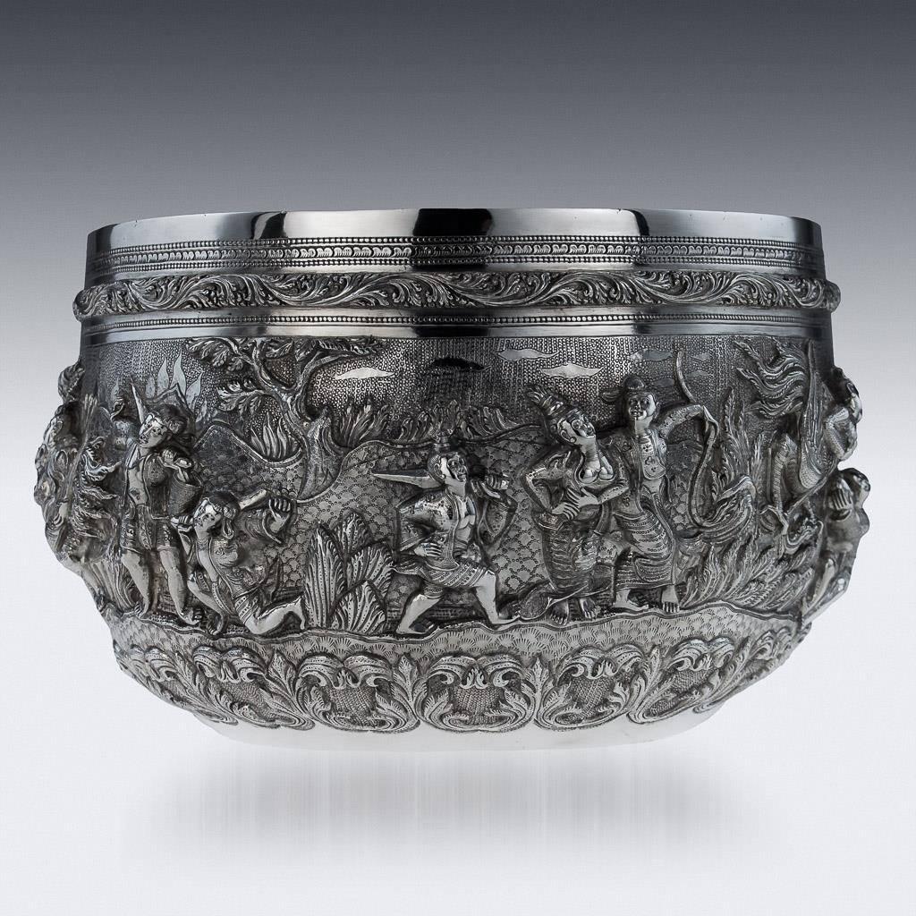 Antique 19th century Burmese, Myanmar solid silver repousse' bowl, large size and particularly heavy gauge, repousse' decorated in high relief with scenes from the Burmese mythology, representing various figures and mythological winged figures in a
