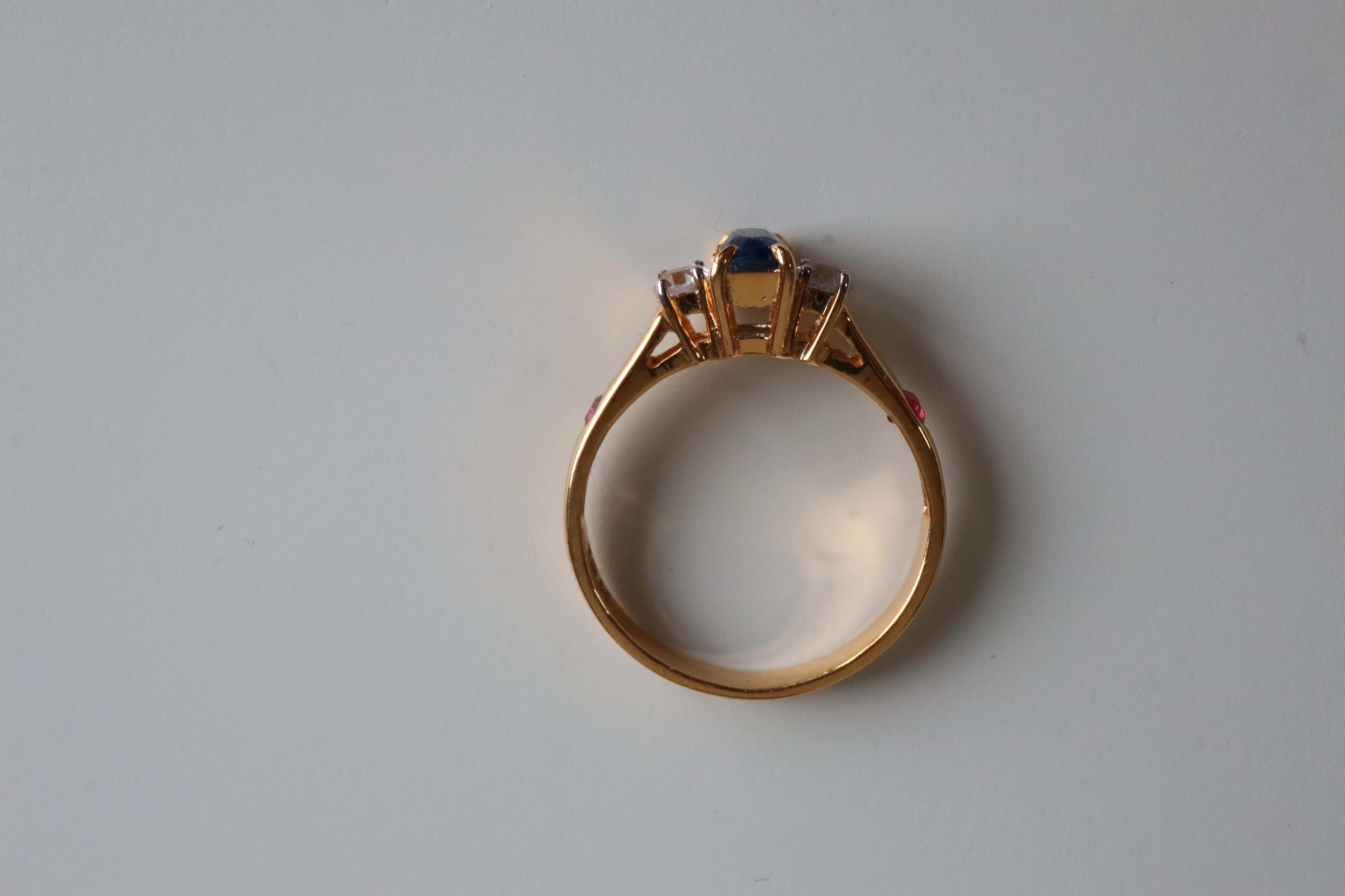 
Burma Unheated Sapphire Ring – Timeless Beauty

This stunning Burma unheated sapphire ring features a vibrant blue center sapphire, complemented by two white sapphires that shine like diamonds, enhancing its elegance. The ring is further