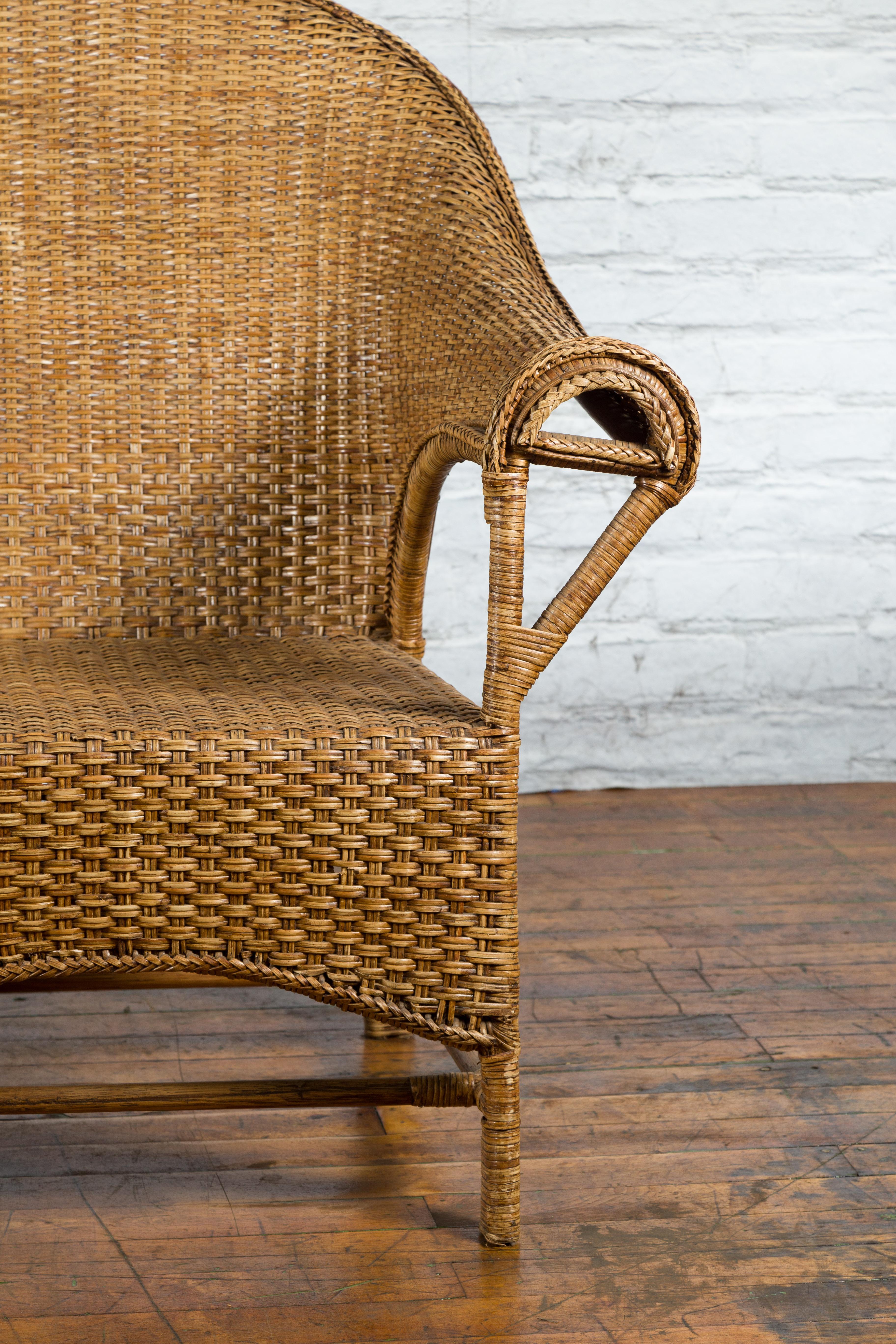 Burmese Vintage Rattan and Wood Loveseat with Curving Back and Unusual Arms In Good Condition For Sale In Yonkers, NY