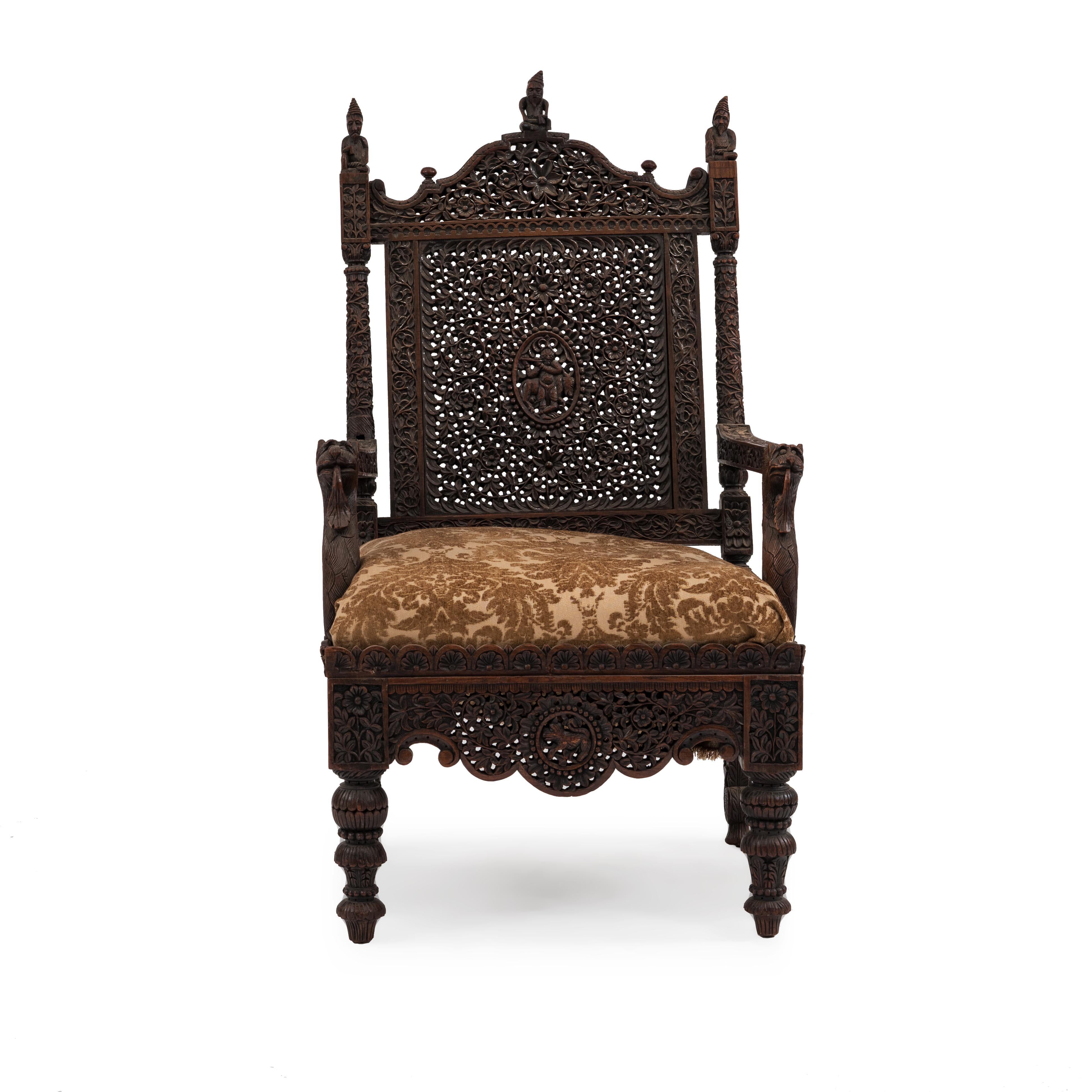 Asian Burmese style carved walnut filigree open armchair with lion arms and cushion seat, (19th century).