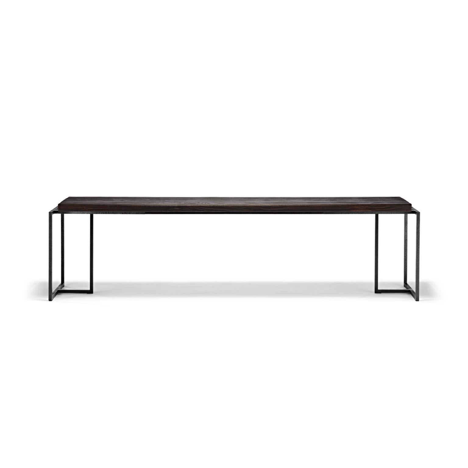 Burned Ash Wood Gerd Bench by Eichkorn
Dimensions: D 180 x W 40 x H 45 cm
Materials: burned ash wood, handcrafted steel surface burnished
Weight: 25 kg

Burned and brushed ash wood on an elaborately worked and black burnished frame. The combination