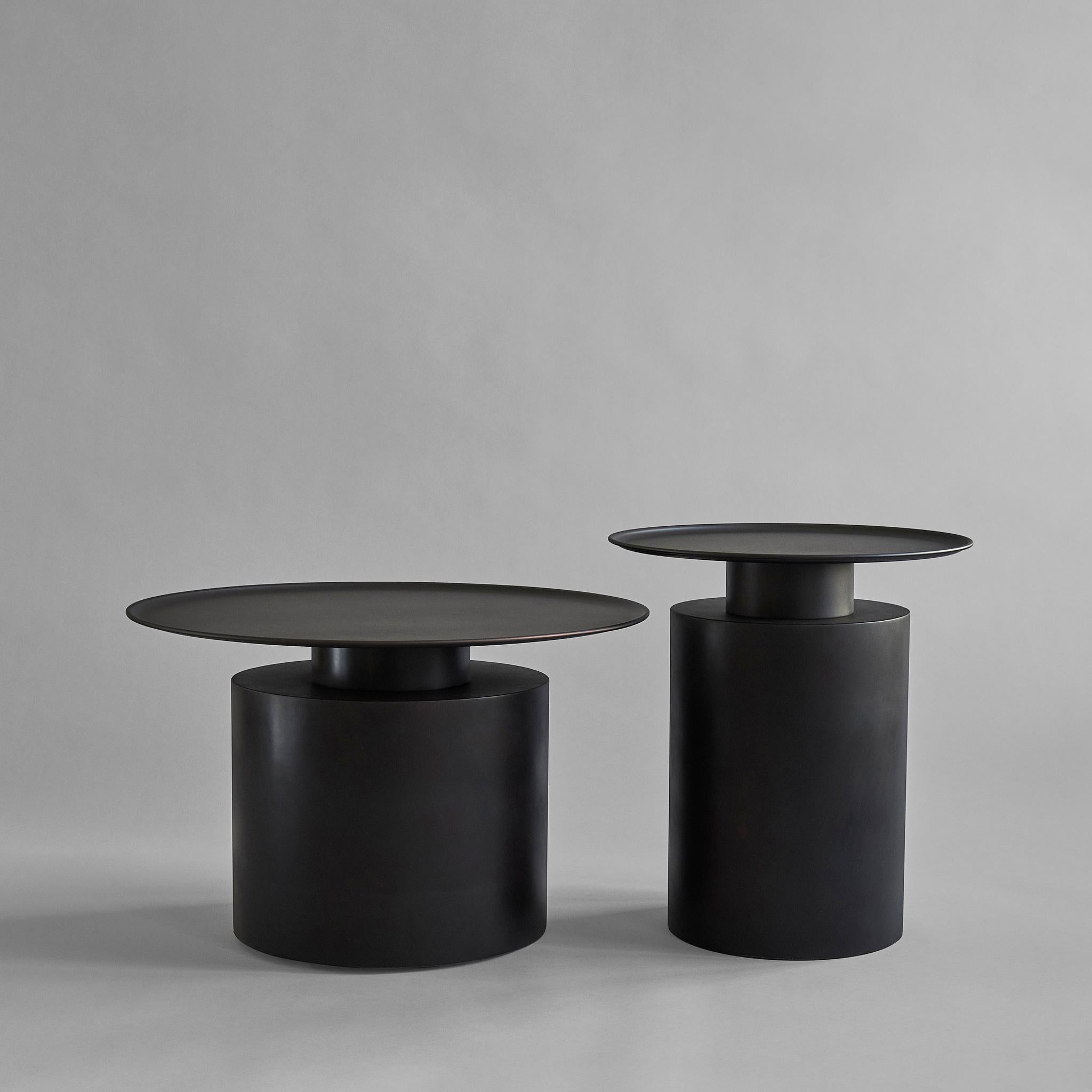 Burned black pillar table low by 101 Copenhagen
Designed by Kristian Sofus Hansen & Tommy Hyldahl
Dimensions: L 41 / W 65 /H 65 cm
Materials: plated metal

Pillar is inspired by the rich lustrous use of material in the 1930´s Art Deco movement.