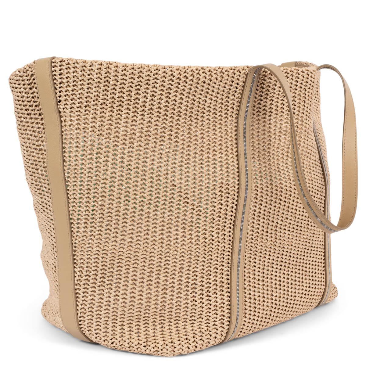 100% authentic Brunello Cucinelli oversized beige raffia tote bag with beige leather handles. Features Monili beading along the straps. Unlined with magnetic closure. The design features a detachable beige leather pouch. Has been carried once and is