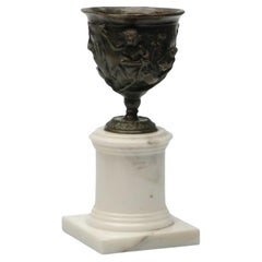 Hercules Burnish brass cup with Carrara marble base