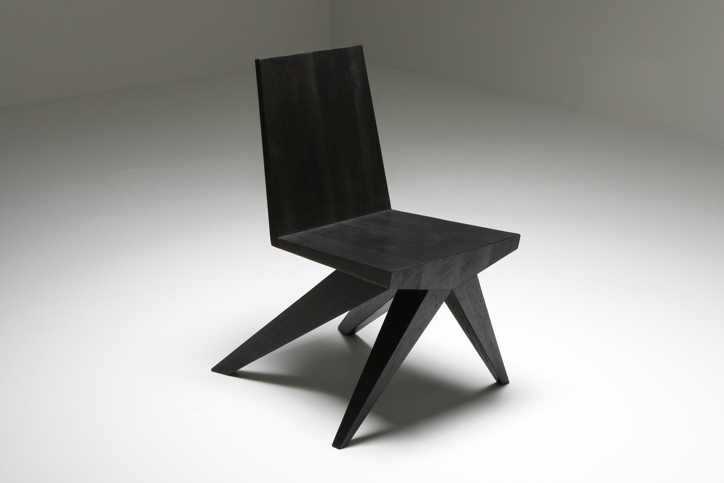 Burnished and waxed Iroko wood. V-dining chair
Arno Declercq, 2020
Black furniture, burnt 
Fits well in an African modernist or Rick Owens inspired decor

Measures: 46 cm wide x 57 cm long x 81 cm high / 18” wide x 22.5” long x 32” high
Seat.