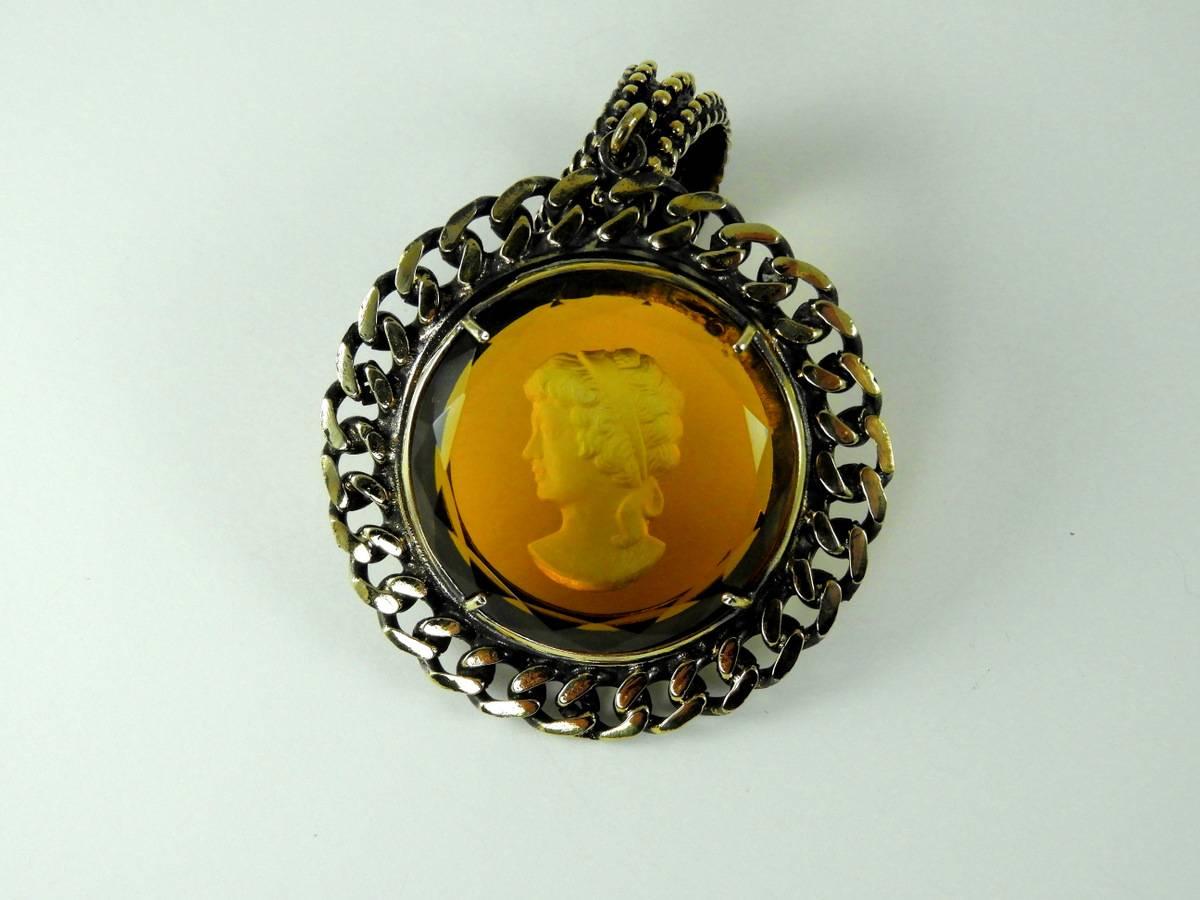 Antiqued and burnished bronze pendant with engraved orange Murano Glass insert. Murano Glass insert have been cut by an expert craftman.  Pendant is handmade in Florence by goldsmith craftman and marked Patrizia Daliana, a famous italian jewelry