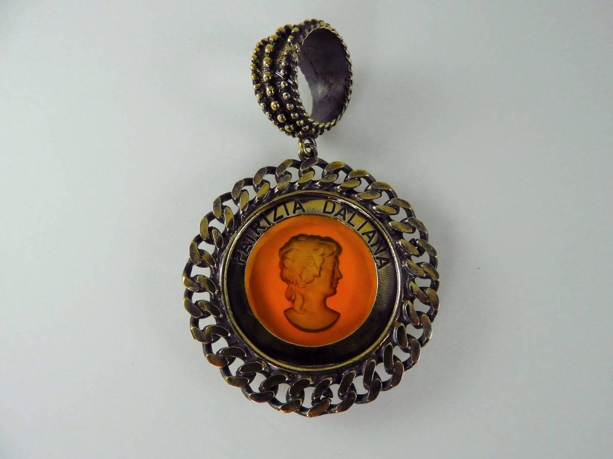  Burnished bronze pendant with engraved Murano Glass insert. 1