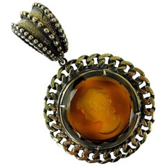 Burnished bronze pendant with engraved Murano Glass insert.