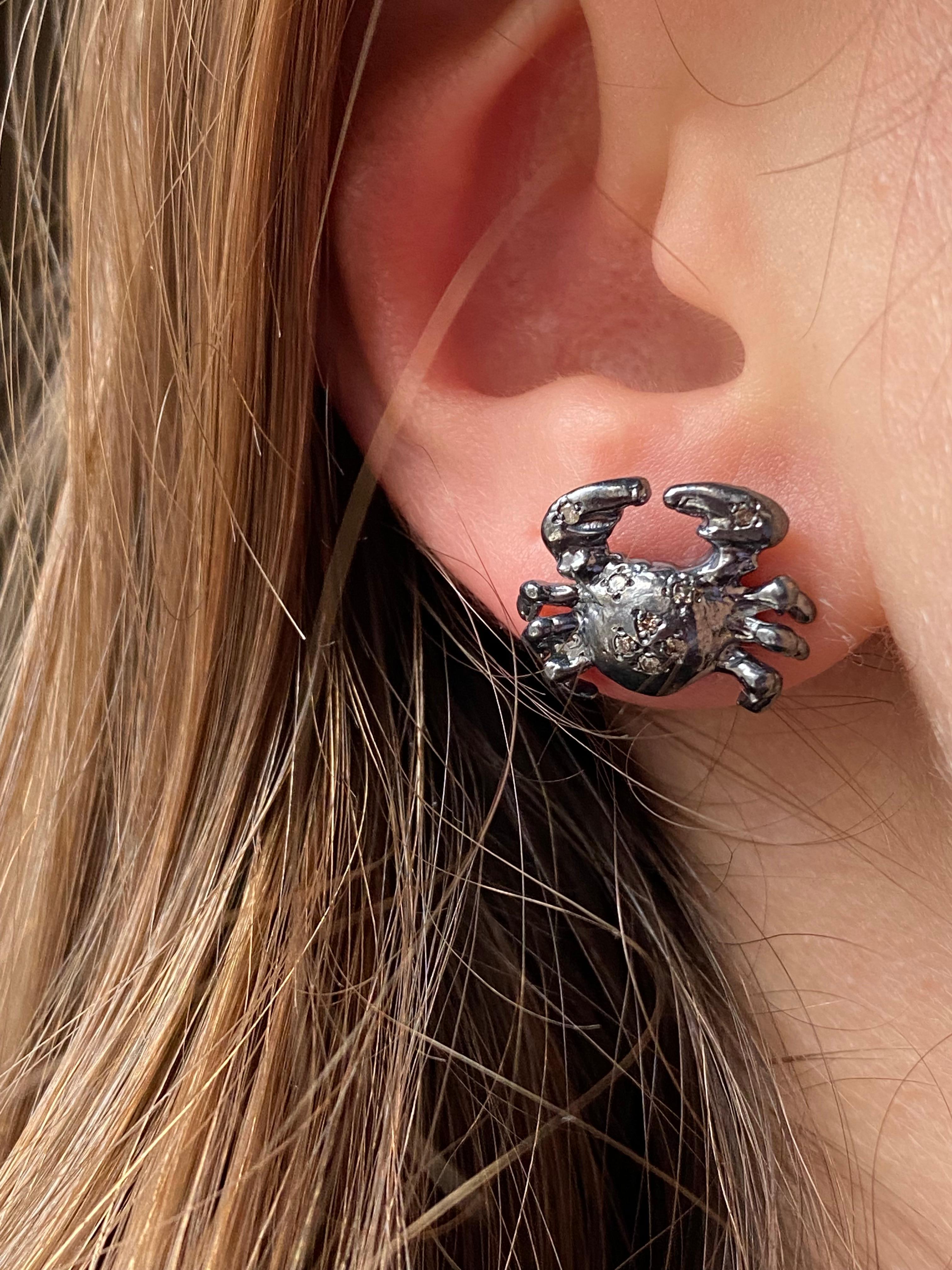 Rock style Cancer Zodiac Sign Burnished stud earrings handcrafted in burnished sterling silver and embellished with beautiful Brown Diamonds. 
These earrings are Inspired by the cancer zodiac sign of people born in july. Cancer people are really