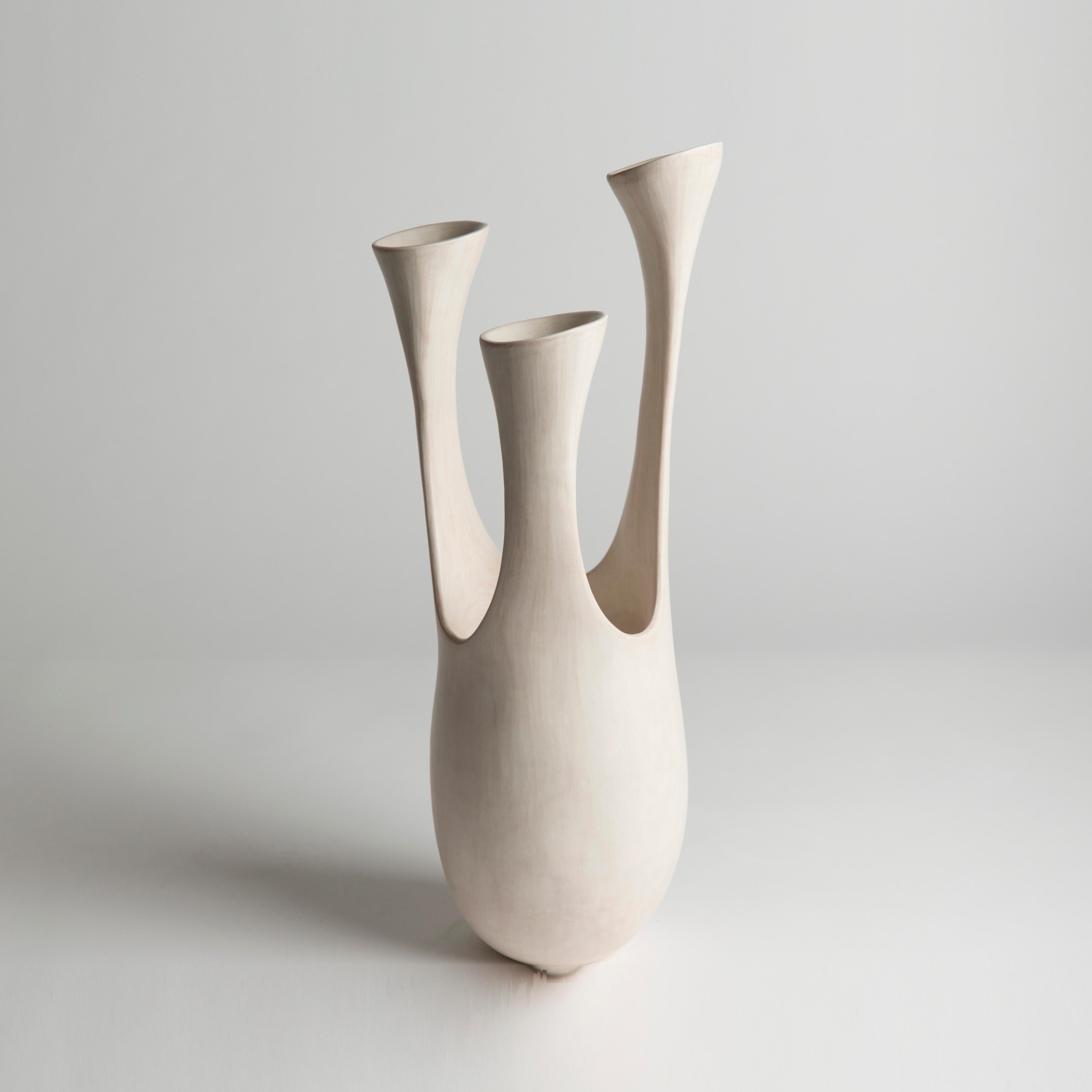 Trio, 2021 (Ceramic, C. 16.5 in. h x 6 in. w, Object No.: 3936)

Tina Vlassopulos was born in London in 1954. After graduating from Bristol Polytechnic in 1977, she returned to London to set up her studio.

Although the work seems to draw ideas from