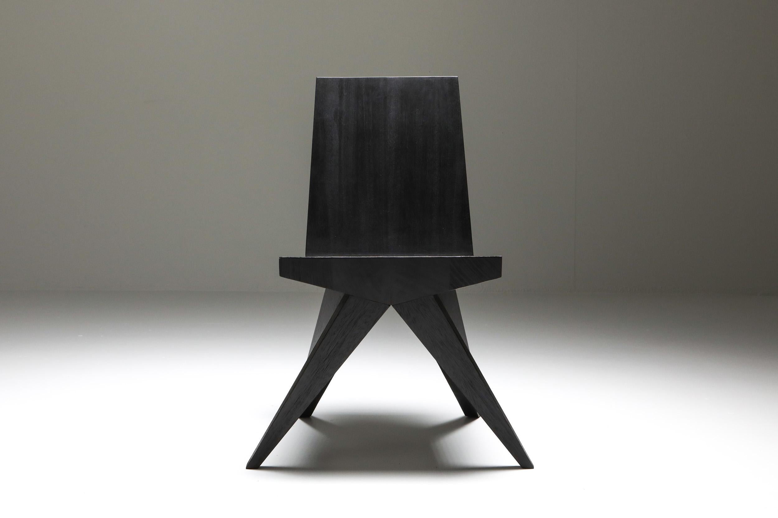 V-dining chair
Burnished and waxed Iroko wood. 

Black furniture, burnt
Fits well in an African modernist or Rick Owens inspired decor

Measures: 46 cm wide x 57 cm long x 81 cm high / 18” wide x 22,5” long x 32” high
Seat. 45cm high x 45 cm