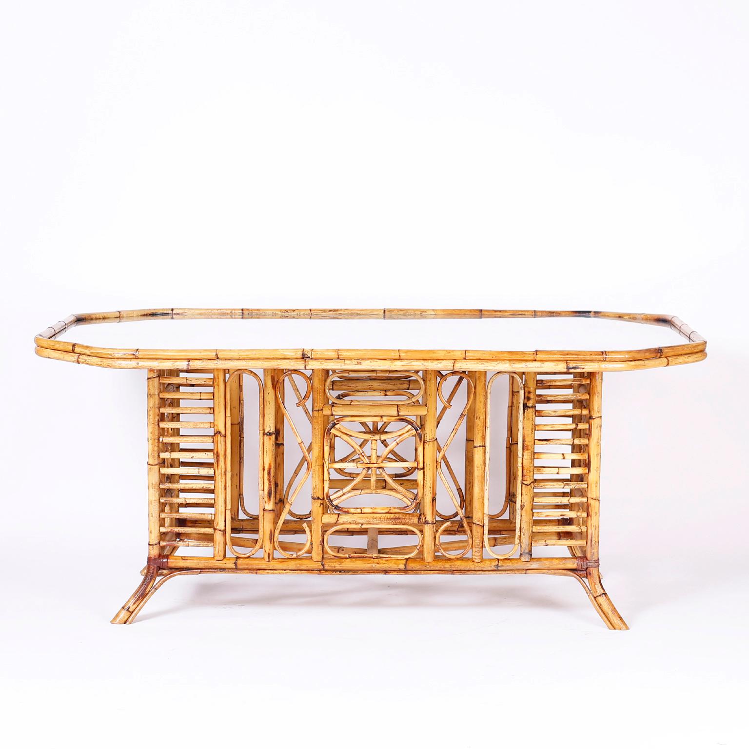 British colonial style bamboo glass top dining table with a strong Brighton Pavilion influence highlighted with burnt and bent bamboo techniques.