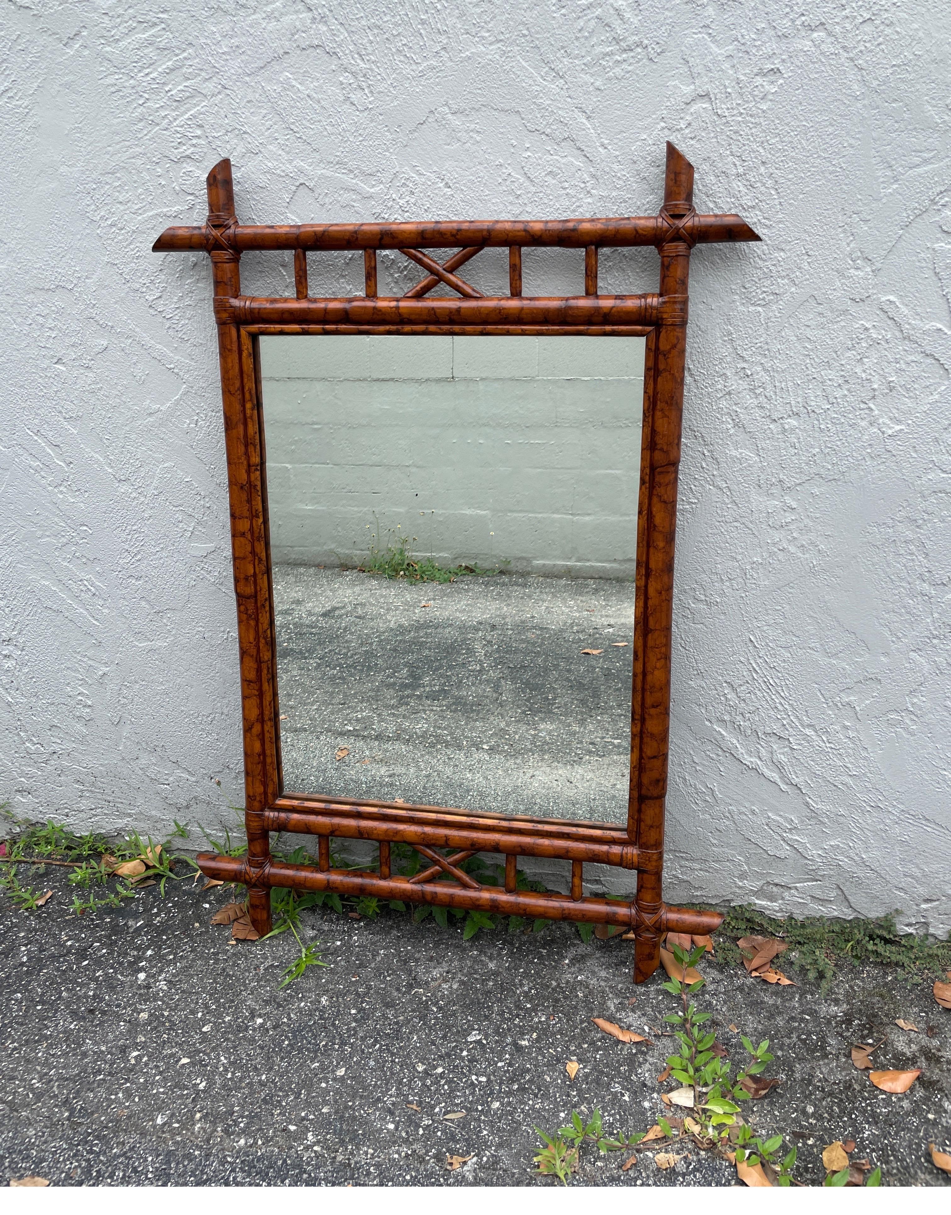 Vintage burnt bamboo mirror with leather ties.