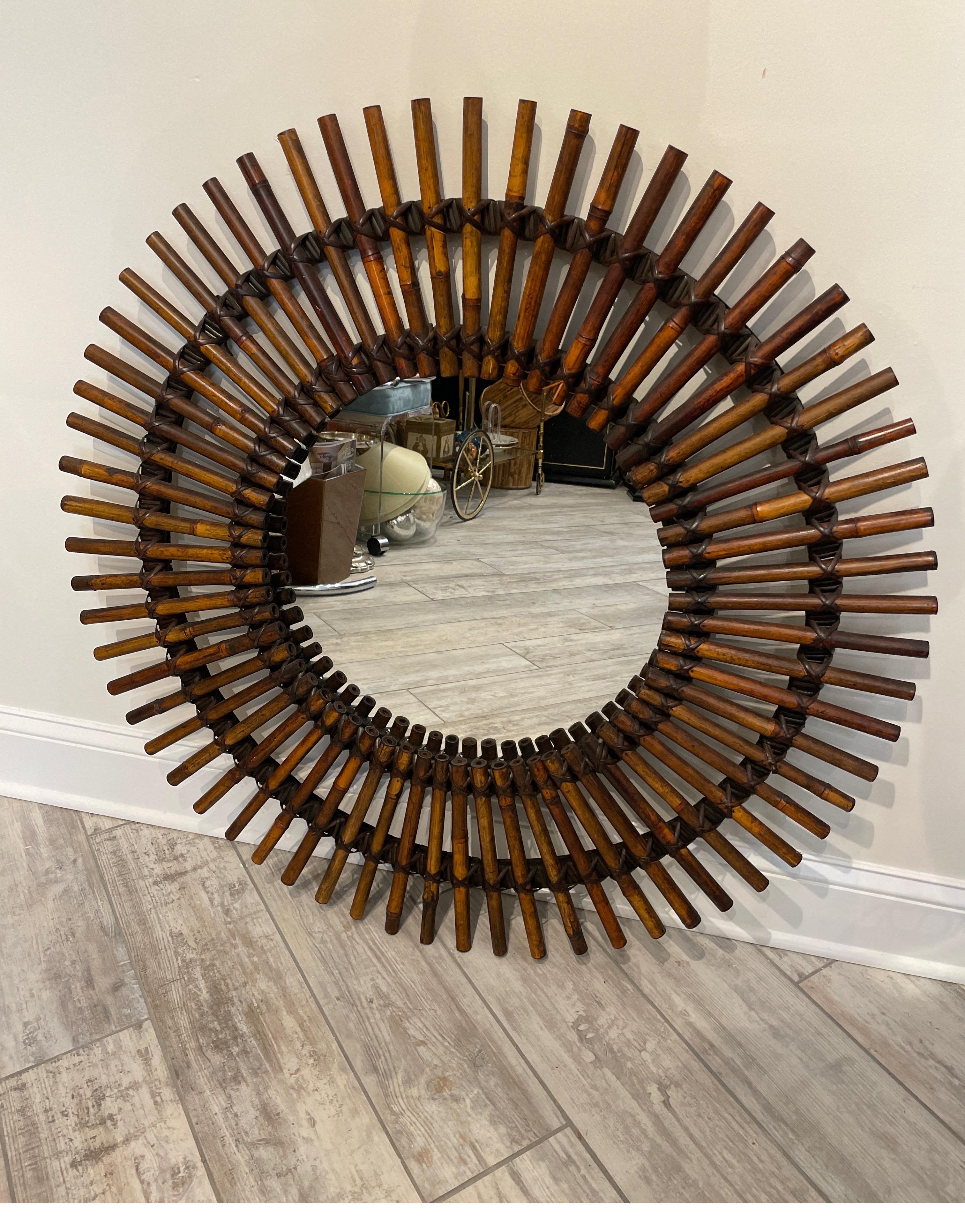 Round burnt bamboo starburst mirror. Each piece of bamboo is hand tied to frame in two places making it very strong. Excellent quality.
