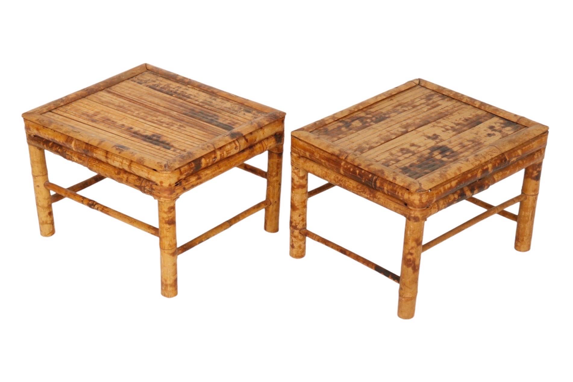 A pair of rectangular foot stools or plant stands made from burnt bamboo throughout which gives the look of exotic tortoise shell. The thick bamboo legs are supported with a pencil bamboo box stretcher. Dimensions per stool.
 