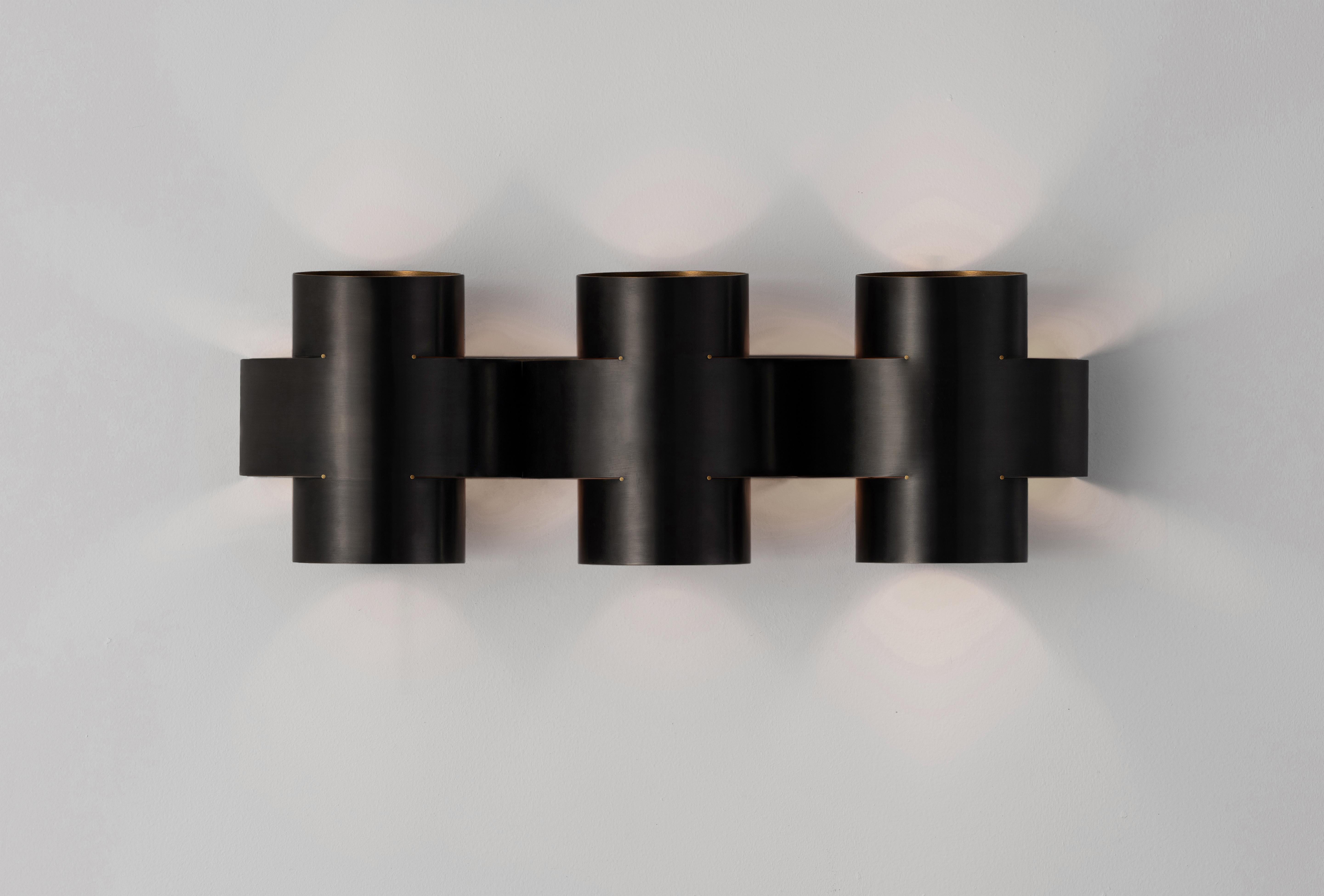 Plus three Applique by Paul Matter.
Dimensions: L 720 mm, H 254 mm, D 155 mm
1 Type E27 Base, 3W - 5W LED
Warm White, Voltage 220-240V
CE Certified
Dimmable upon request
Materials: Brass

Finished in burnt, aged, buffed brass and buffed