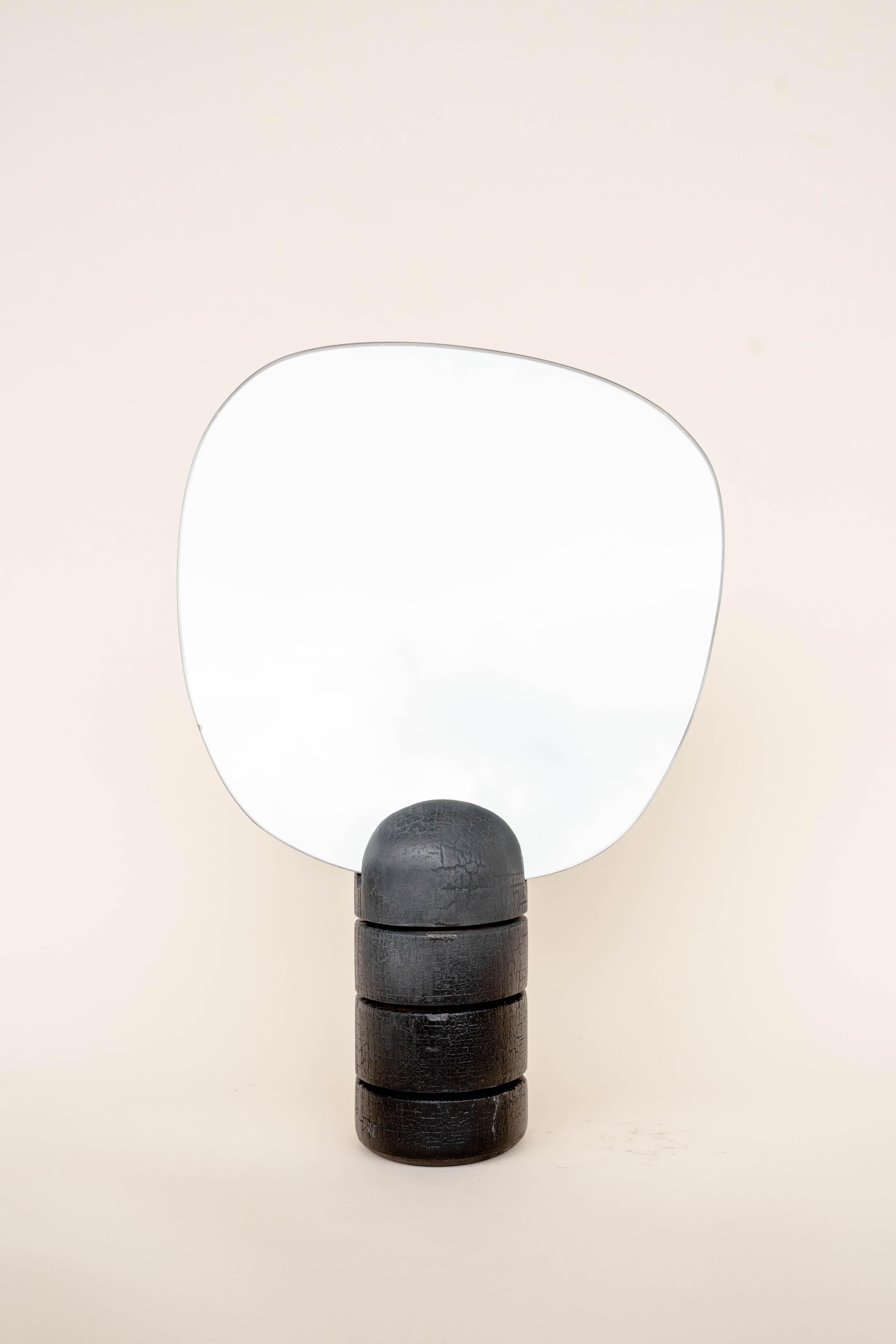 Burnt mirror with cuts by Daniel Elkayam
One of a Kind
Dimensions: D 10 x W 27 x H 42 cm 
Materials: Burnt beech wood


Jerusalem-born Art-designer and Photographer based in Tel-Aviv. Operating in the field of sustainable home decor and