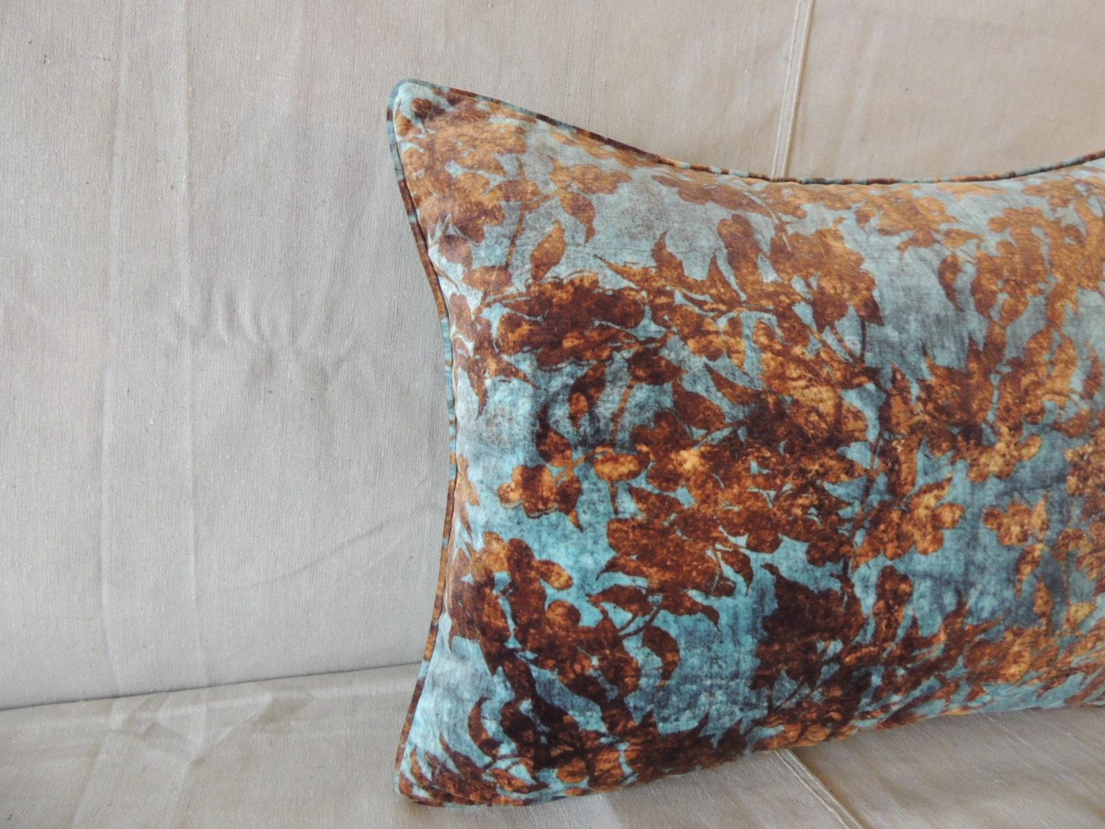 Burnt orange and aqua velvet modern bolster decorative pillow.
Solid brown velvet backing and self welt.
Decorative pillow handcrafted in Portugal.
Zipper closure with custom-made pillow insert.
Size: 15