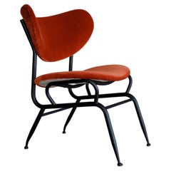 Burnt orange midcentury chair in style of Gastone Rinaldi