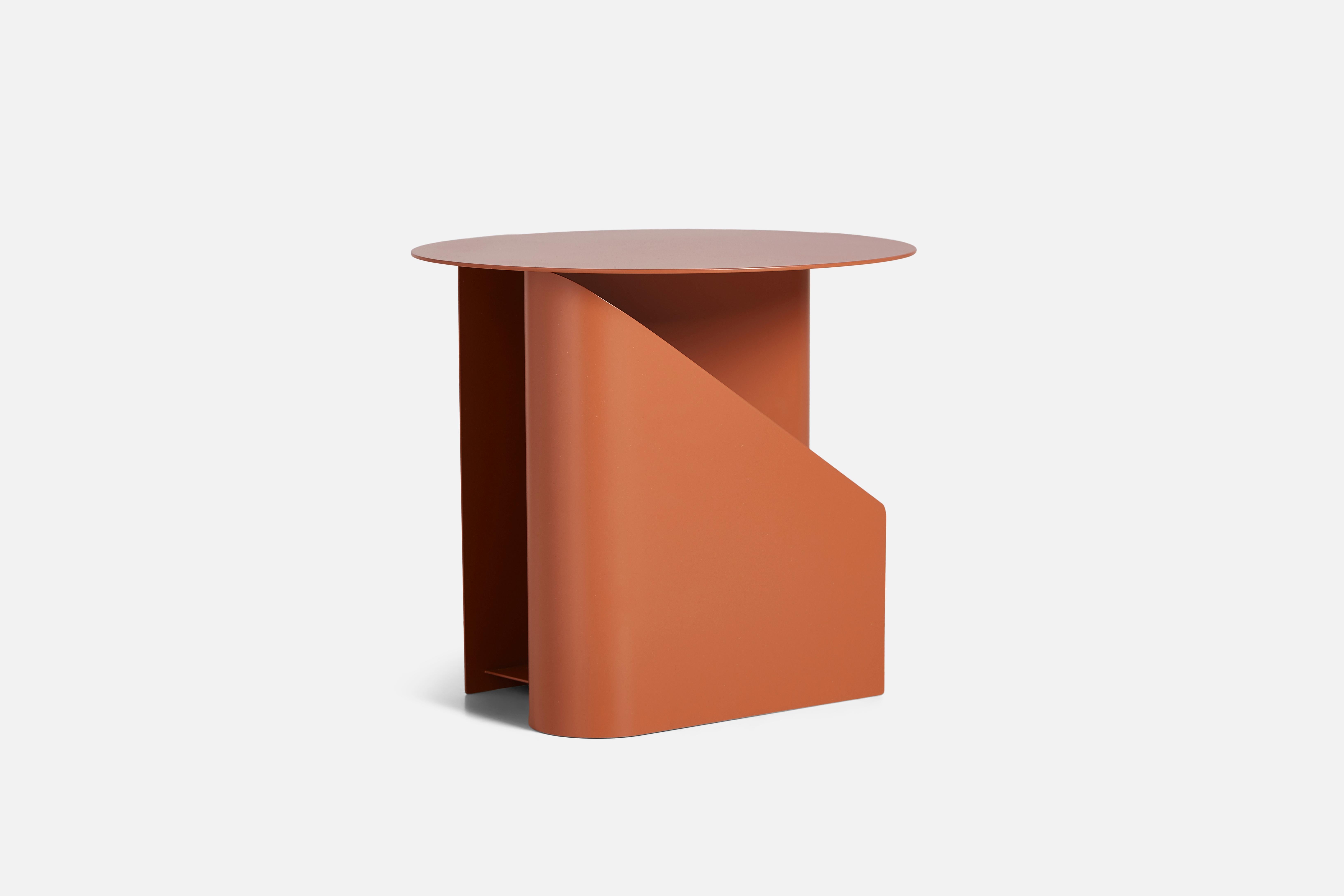 Burnt orange Sentrum side table by Schmahl +Schnippering
Materials: Metal
Dimensions: D 40 x W 40 x H 36 cm
Also available in different colours.

The founders, Mia and Torben Koed, decided to put their 30 years of experience into a new project.