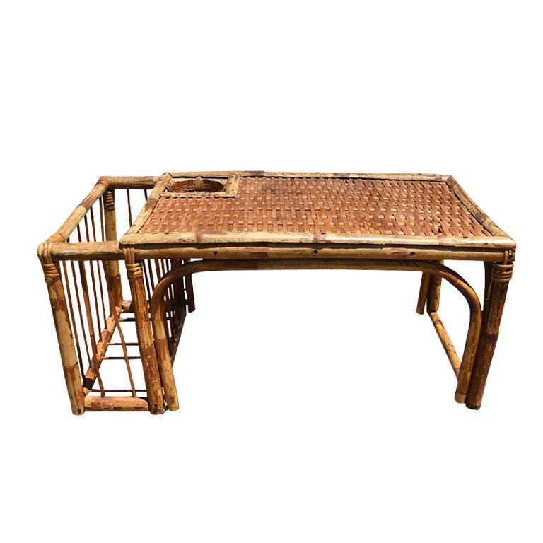 A vintage burnt bamboo or tiger/tortoise bamboo breakfast bed tray. Created from a mixture of wicker, wood, and bamboo this serving tray will be a thoughtful touch to any guest room. The top of the tray is covered in lighter woven wicker in brown.