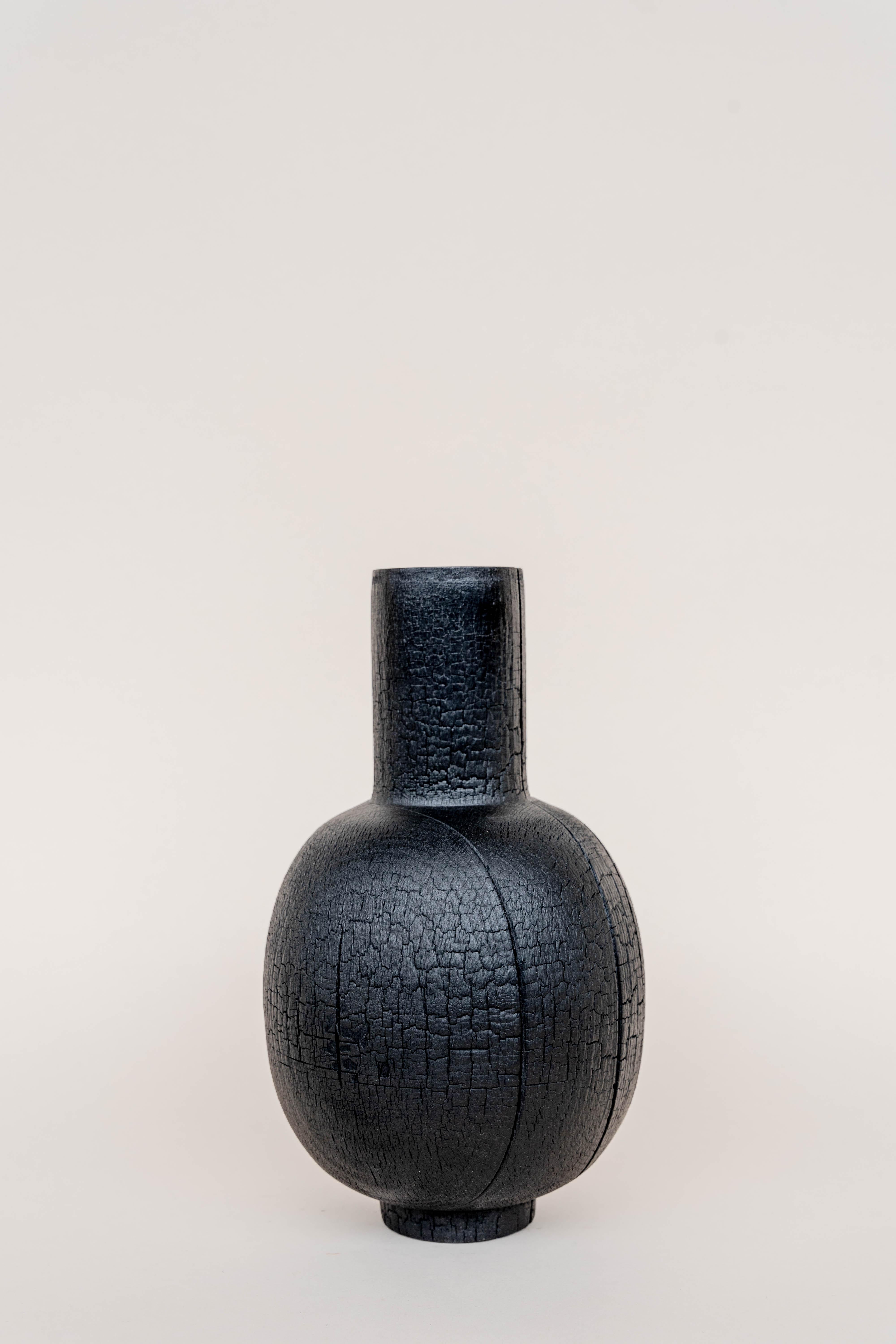 Burnt vase XL #4 by Daniel Elkayam
One of a Kind
Dimensions: D 15 x W 15 x H 45 cm 
Materials: Burnt beech wood


Jerusalem-born Art-designer and Photographer based in Tel-Aviv. Operating in the field of sustainable home decor and specializing