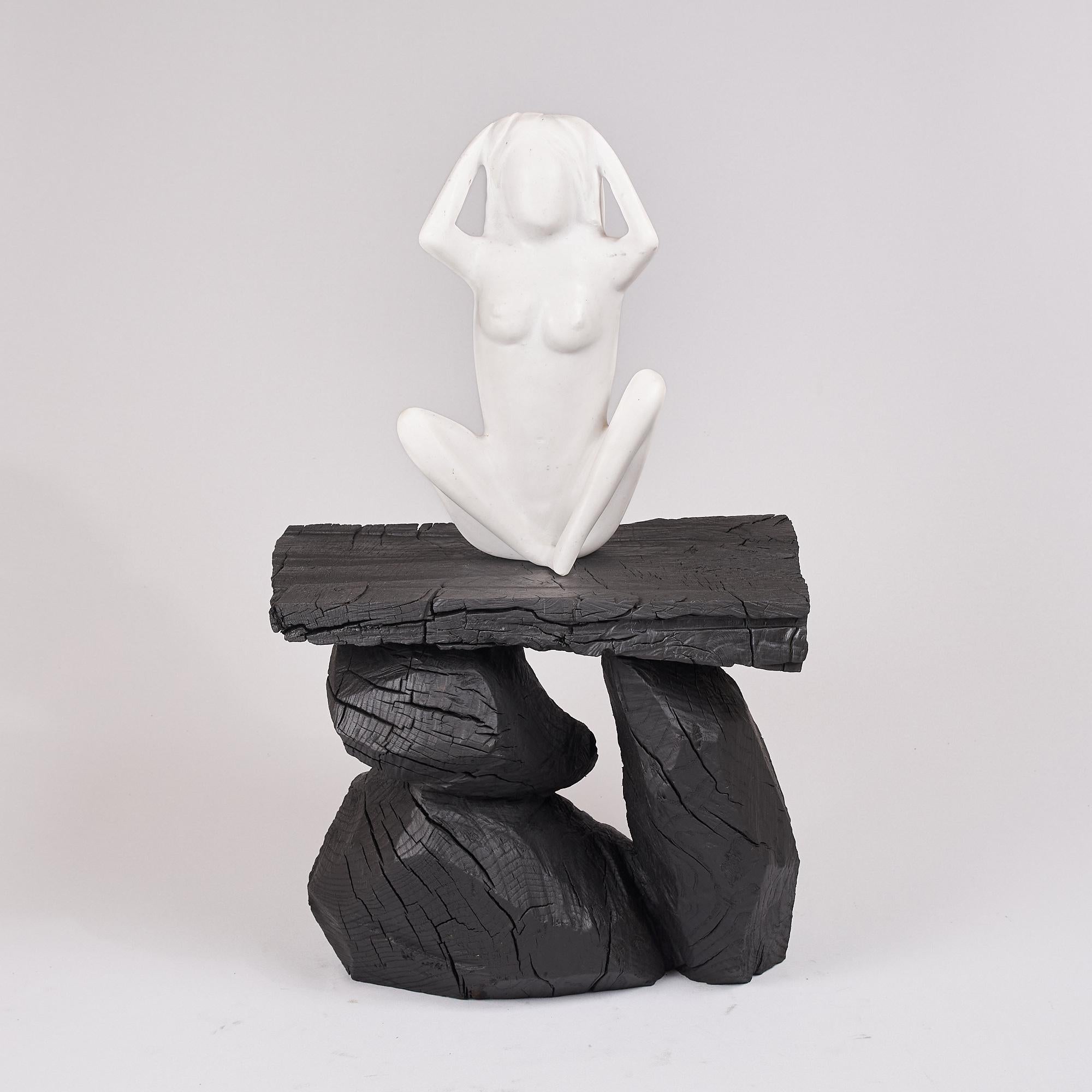 Unique chainsaw carved wooden functional sculpture usable as a stool or a side table. Carved from a single piece of oak wood and protected with the highest quality oils, ensuring durability for generations. Such unique handmade design will highlight