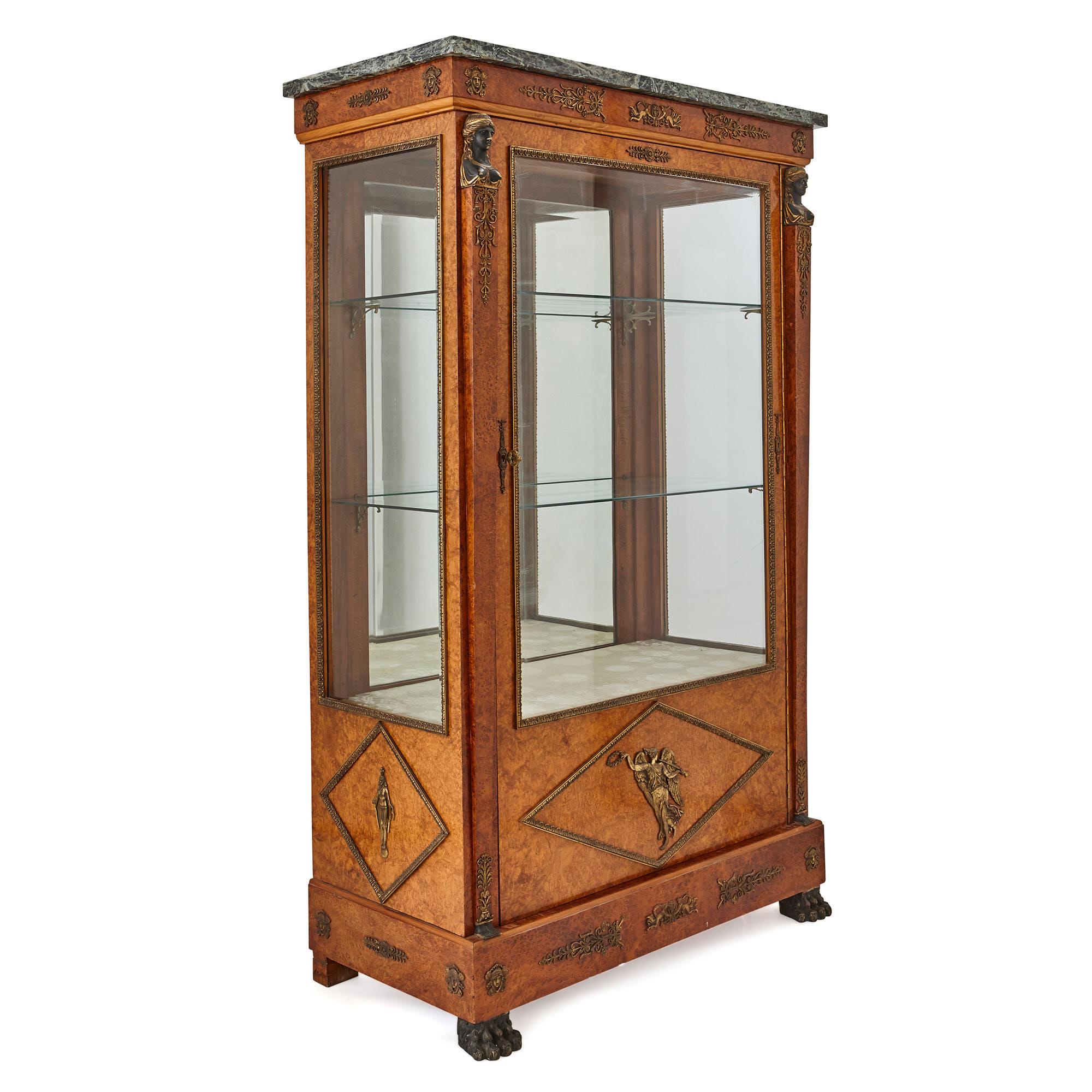 This beautiful display cabinet was crafted by the prestigious furniture company, Maison Krieger. The firm was founded in 1826 by Antoine Krieger. Over the course of the 19th century, the firm changed its name several times, but it remained within