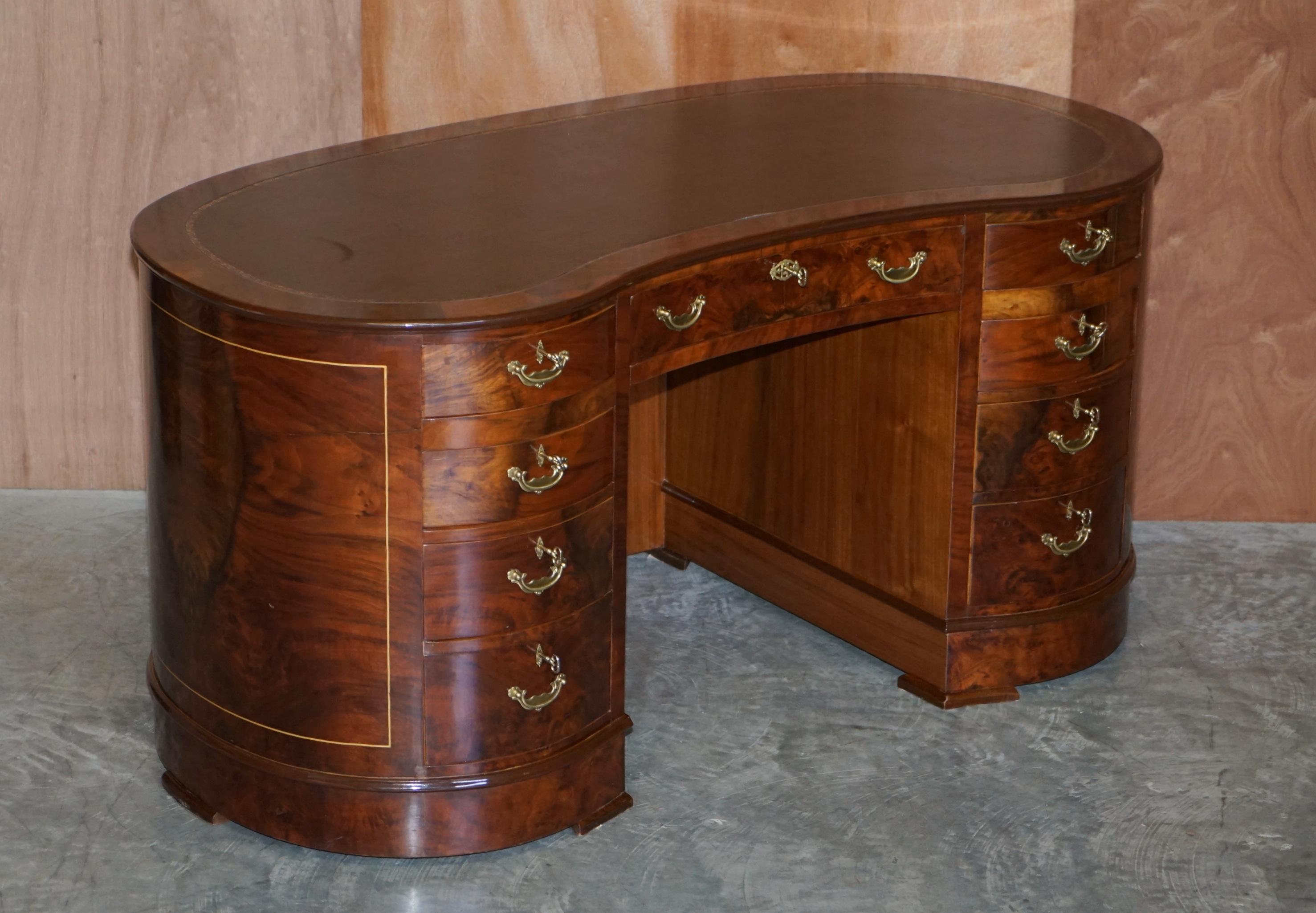 We are delighted to offer for sale this Burr & Burl walnut veneer kidney desk with nine drawers to the front and twin cupboards to the rear

A good-looking well-made desk, its one solid piece and very substantial. The desk has nine drawers to the