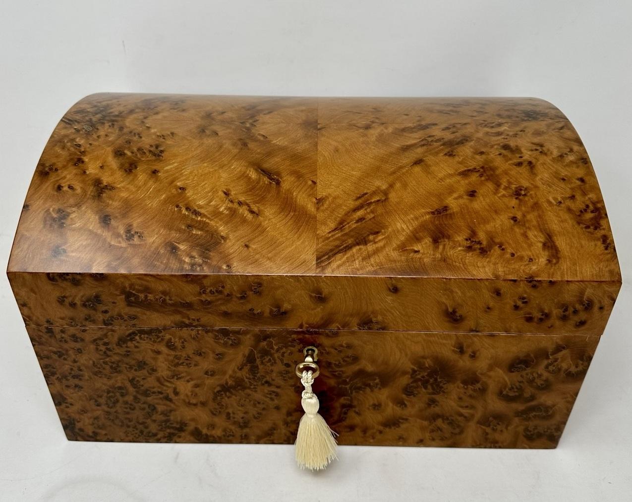 Stunning well figured Thuya wood ladies or gentleman's jewelery box casket made by Manning of Ireland of generous proportions and of outstanding quality, with interior and lift out tray lined in luxury dark navy blue velvet lining, complete with two