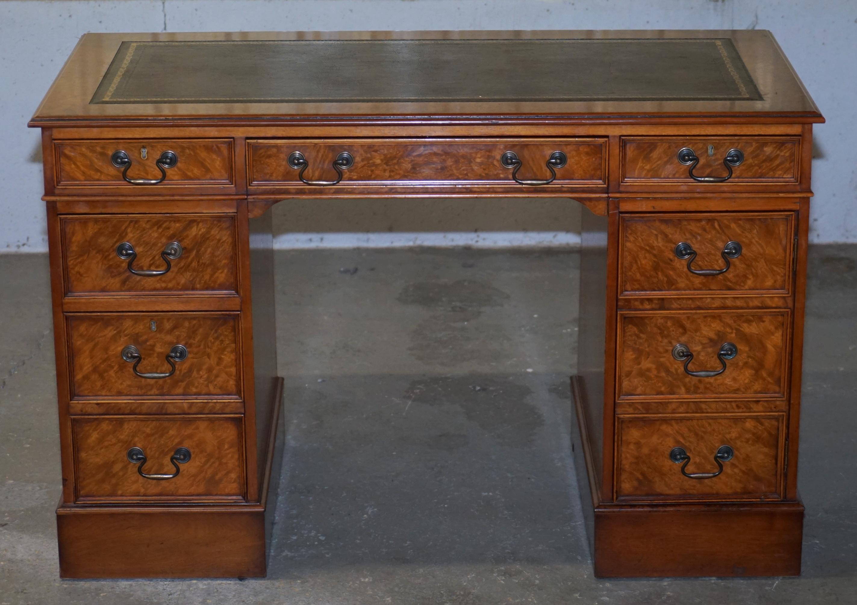 We are delighted to offer for sale this lovely custom made burl walnut twin pedestal partner desk specially designed to hide a computer

A good looking and well made desk, it has a hiding sliding keyboard or laptop shelf, the right bottom three