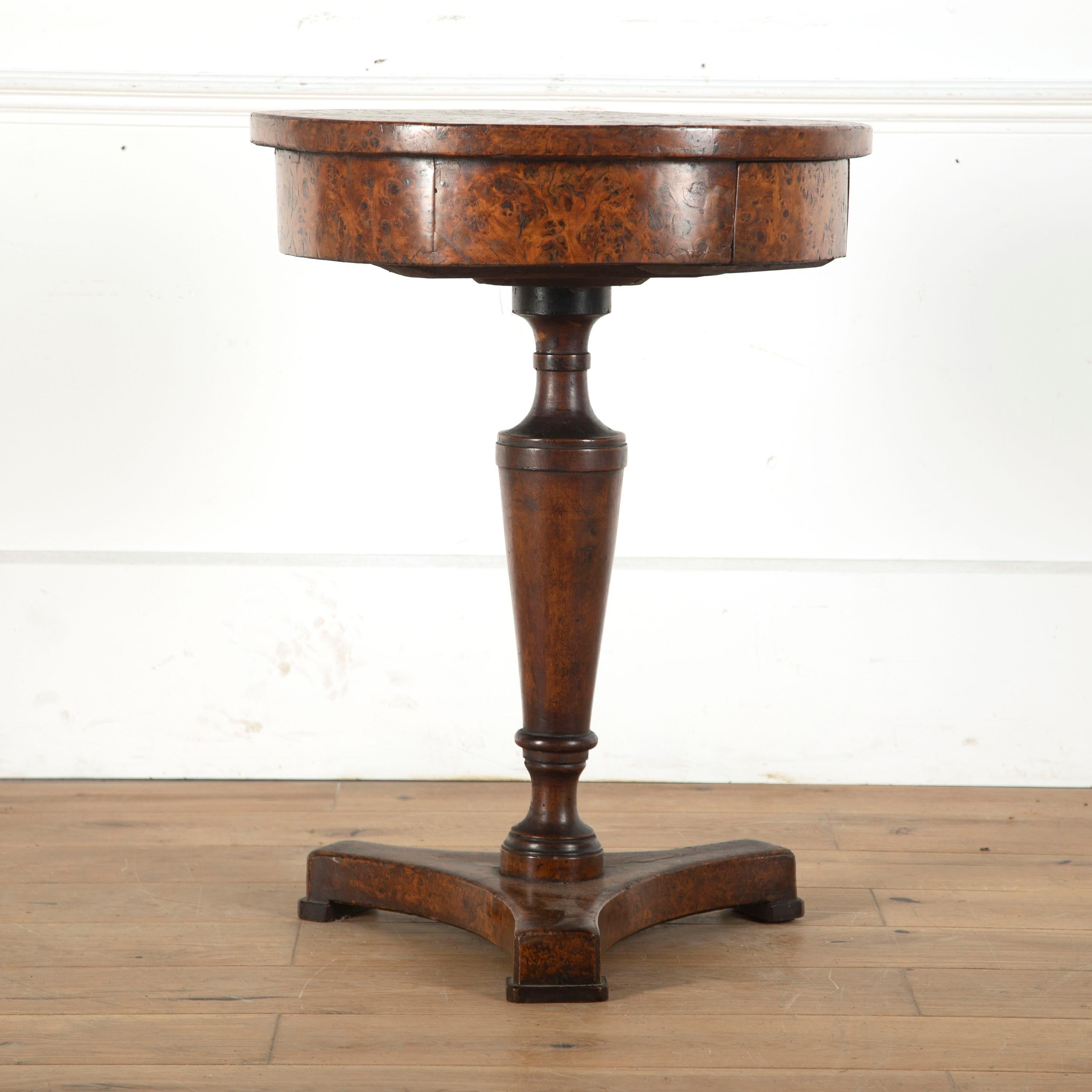 Rare Italian burr oak occasional table, circa 1820.

Featuring a single drawer to the frieze, this table is supported by a vase pedestal on a triform base.
