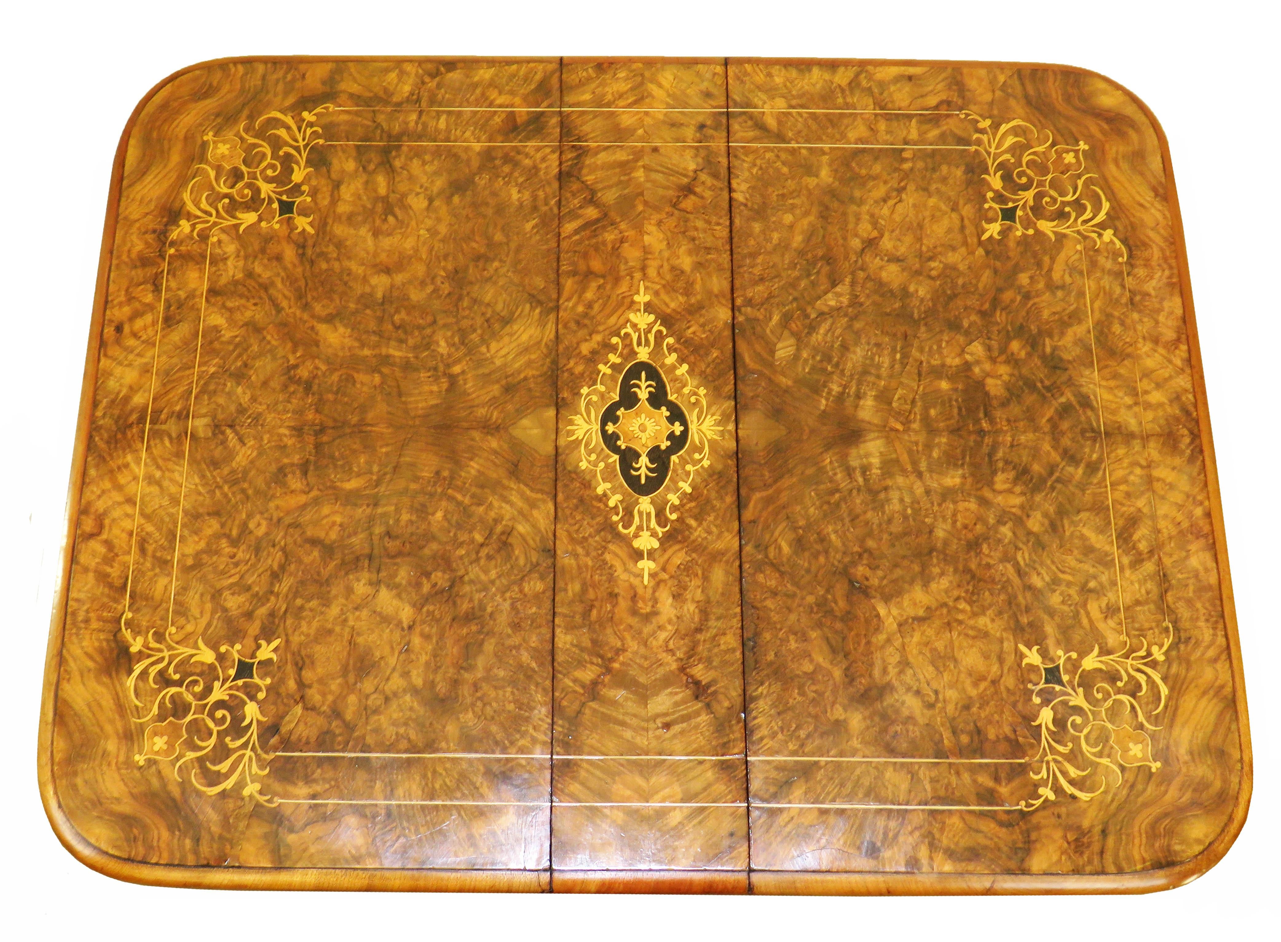 A superb quality late 19th century burr walnut
baby Sutherland coffee table having beautifully
figured drop flap top with attractive marquetry
inlaid decoration raised on elegant turned end
supports and cabriole legs with carved decoration
and