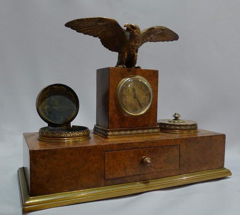 Burr walnut and ormolu desk set signed Appay a Paris. A very smart Parisian turn of the 19th century desk set comprising a pair of inkwells with a pin drawer and an 8 day clock above which stands a baiting Eagle. The set is ormolu-mounted but