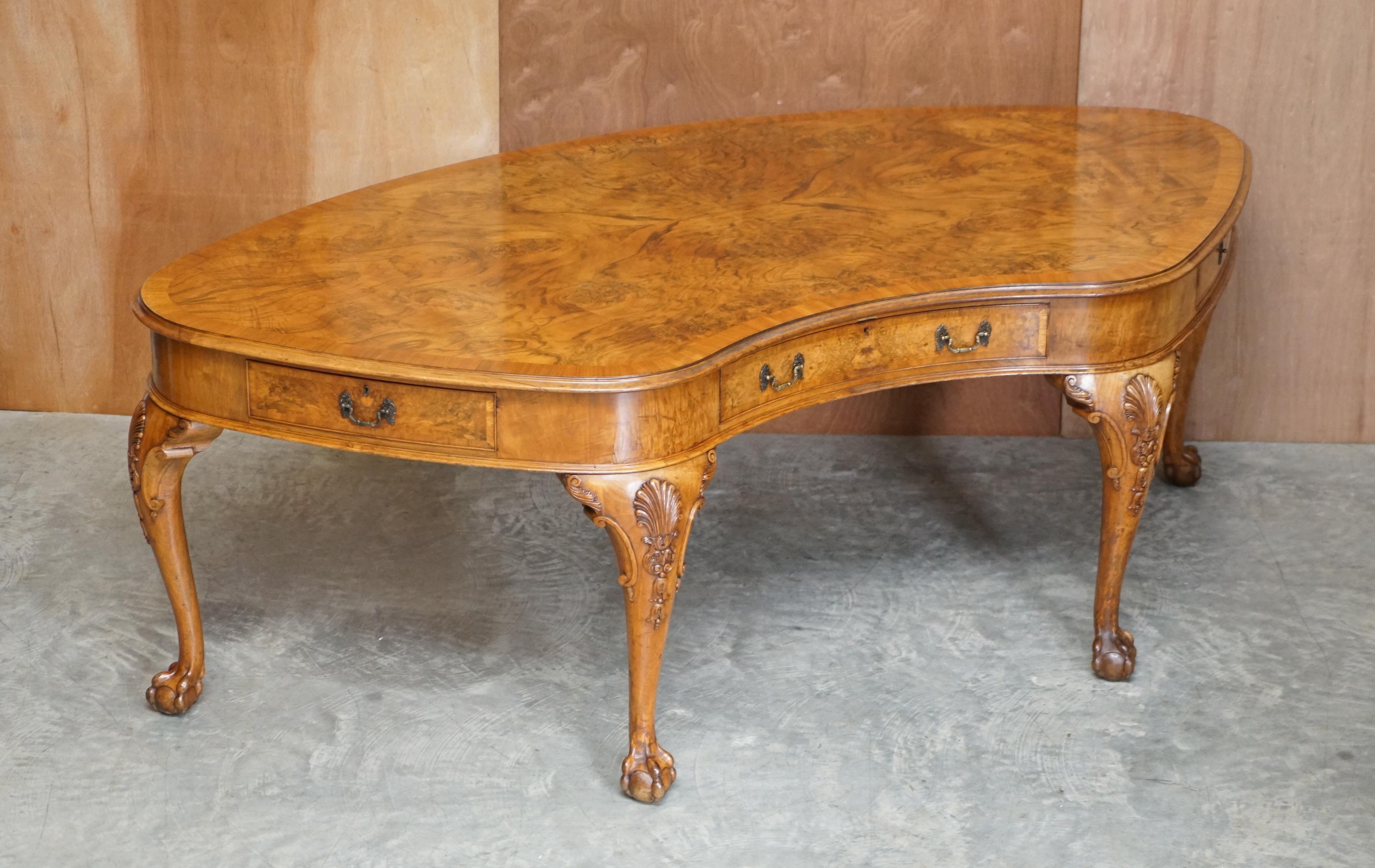 We are delighted to offer this important late Victorian burr walnut kidney library table desk with Georgian Irish style cabriolet legs finished with claw & ball feet

This piece will honestly leave you speechless, firstly, it is very large, both