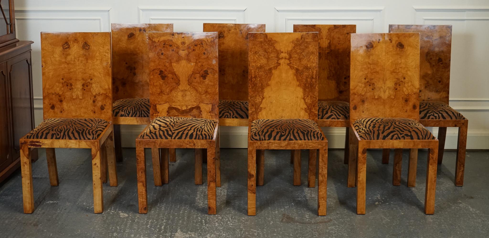 Antiques of London



We are delighted to offer for sale this Lovely Set Of 8 Dining Chairs.

The Burr Walnut veneer Art Deco style animal print seats set of 8 dining chairs is a luxurious and visually striking collection that combines classic art