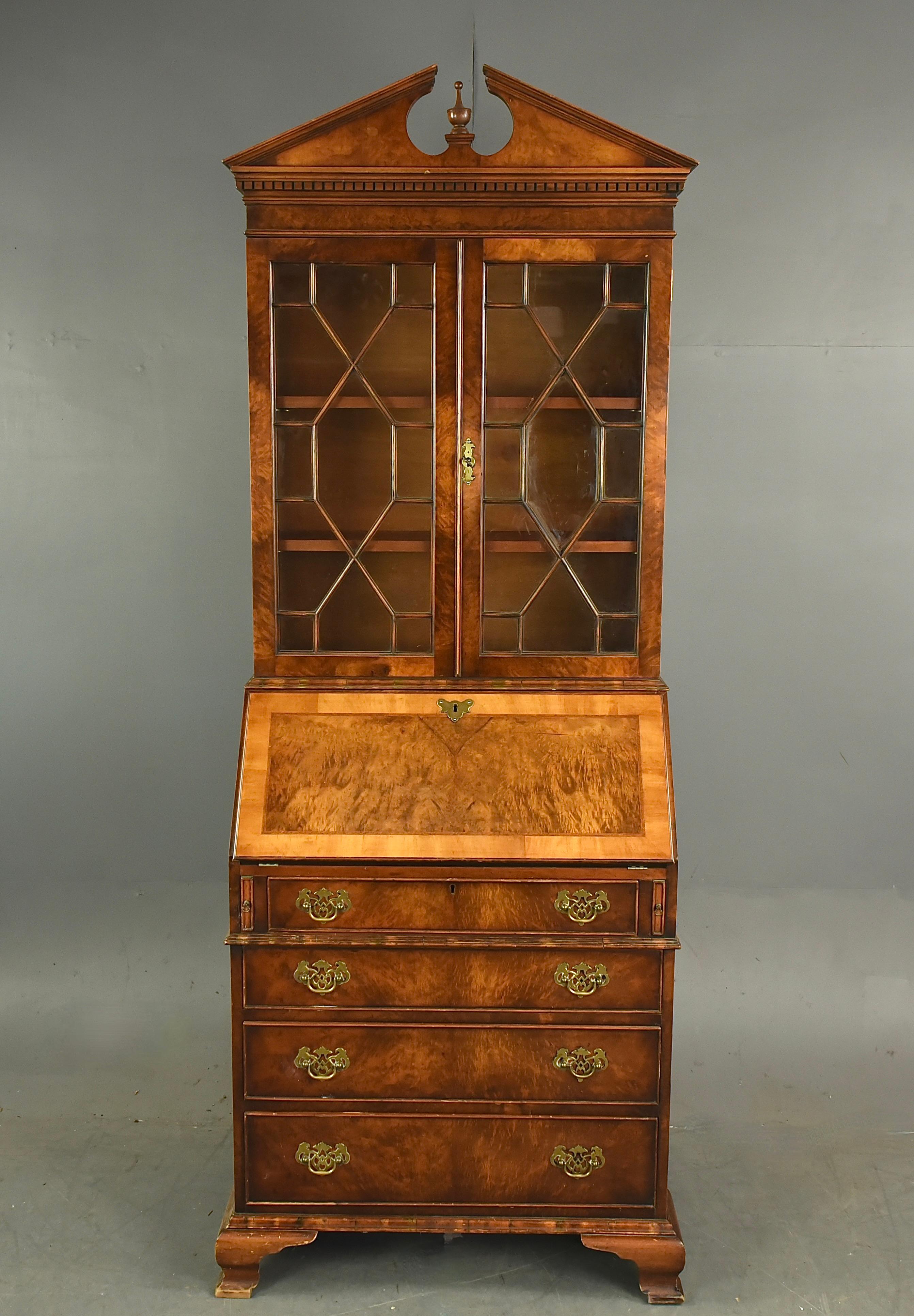 Fine Quality burr walnut bureau bookcase by Brights of nettlebeds circa 1960 .
The bookcase is a well proportioned small size the top with an architectural cornice ,the top has two adjustable shelves .behind two astragal glazed doors with a working