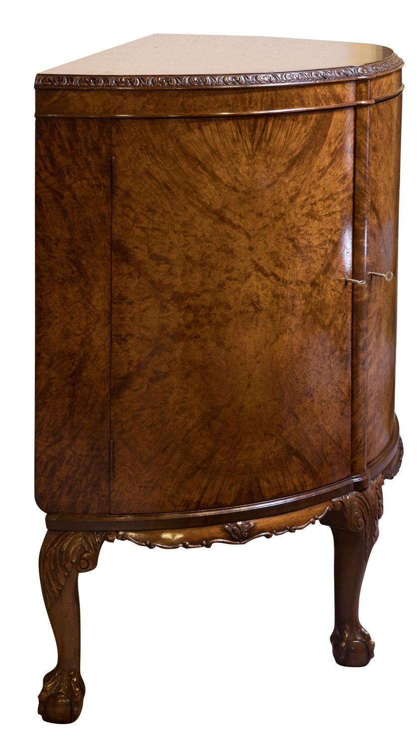 Burr walnut demilune cabinet by Waring & Gillow

circa 1930.