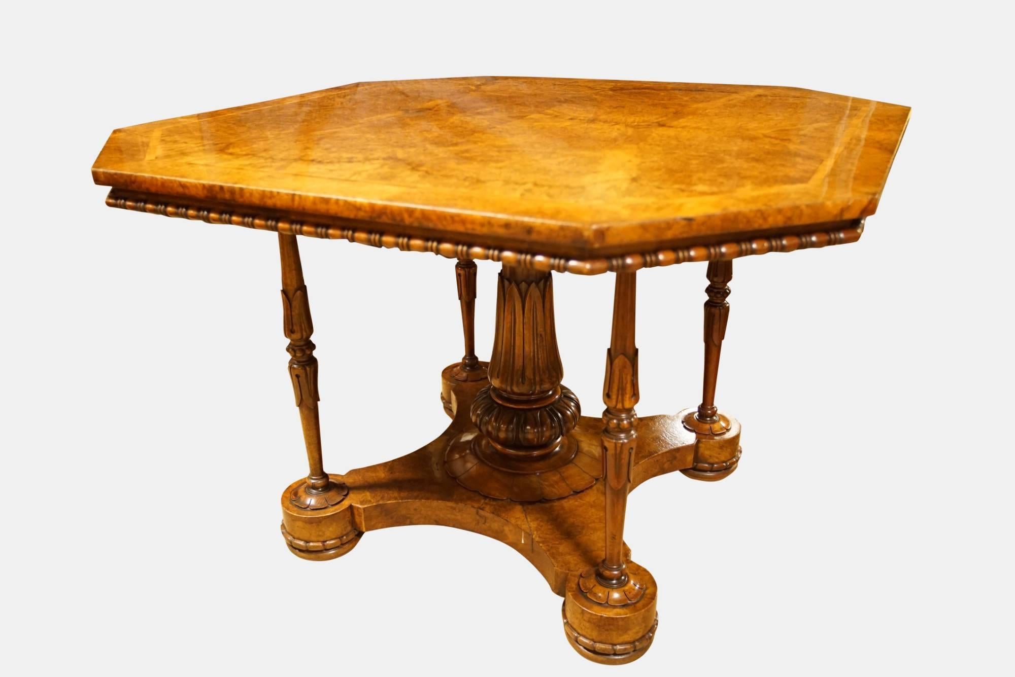 A fine burr walnut octagonal centre table in the manner of Holland & Sons,

circa 1865.