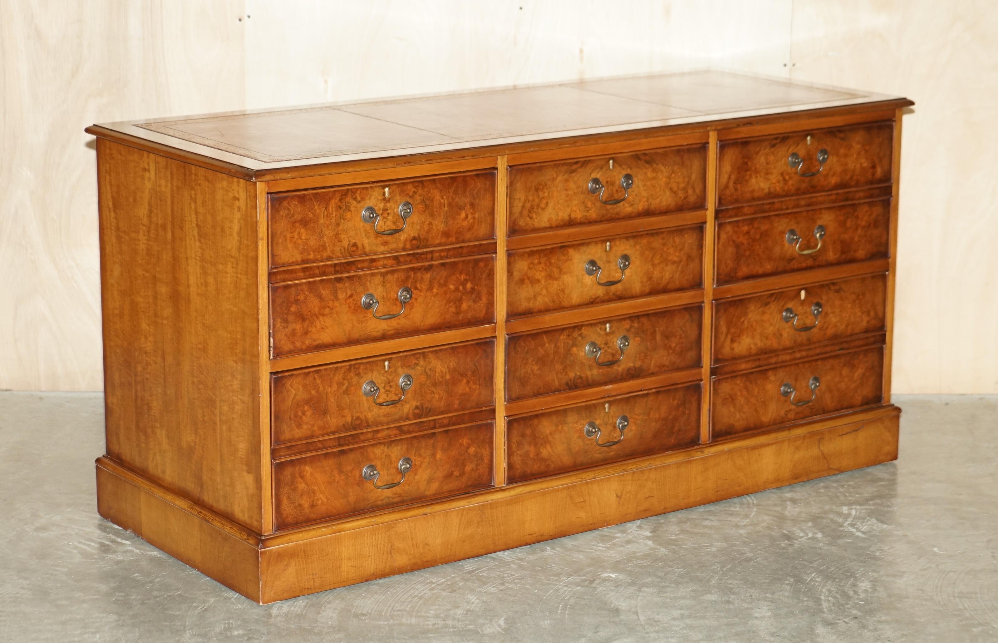 We are delighted to offer for sale this lovely Burr Walnut triple bank filing cabinet with three drawers to the middle and Oxblood leather top

A truly stunning piece, if burr walnut is your thing or just timber patina that is to die for then look
