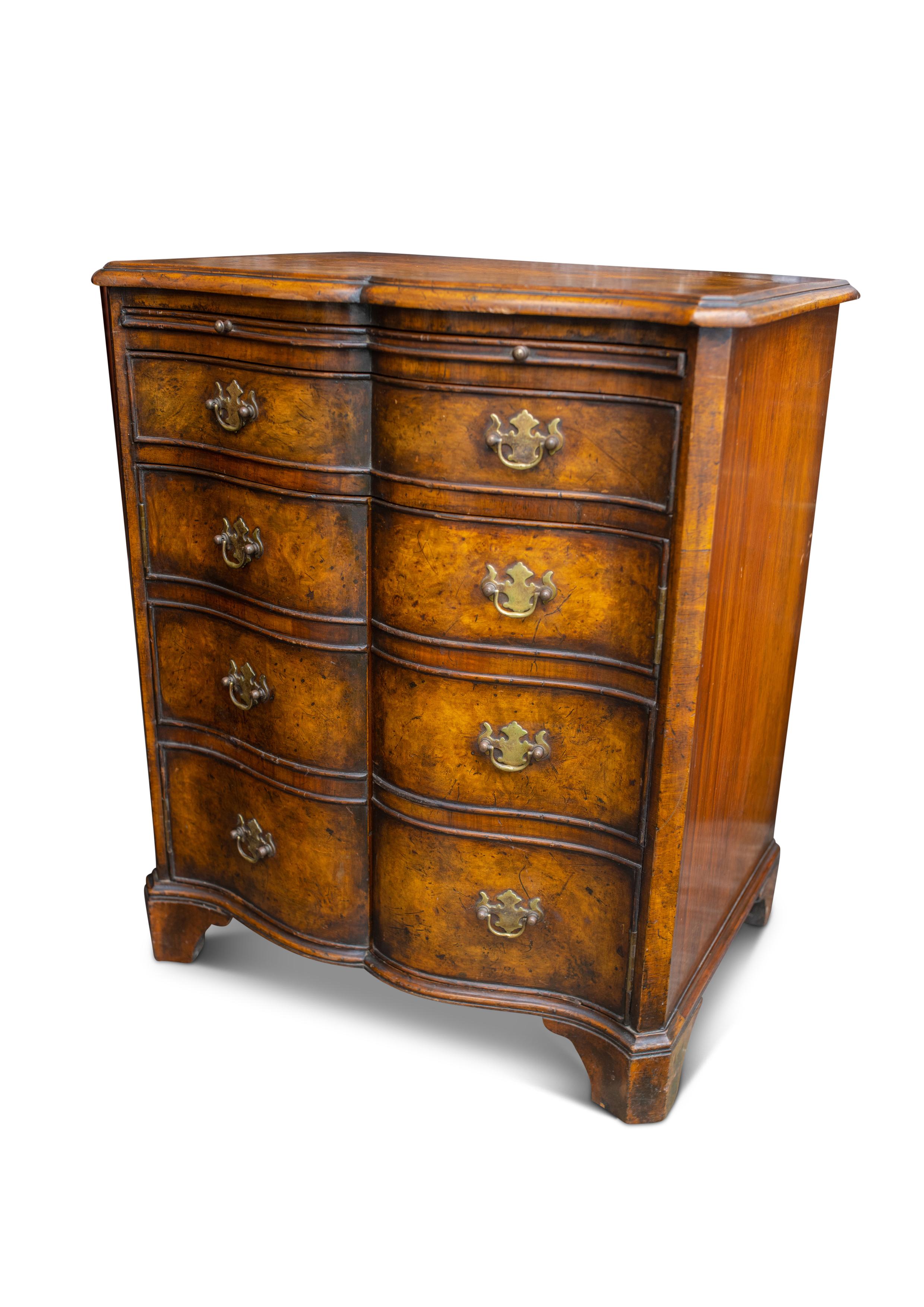Burr Walnut Reverse Serpentine Two Door Batchelor's Cabinet With Single Drawer & Brass Bat Wing Handles in the Georgian Style.

Would work as a great lamp table, a solo nightstand or a petite drinks cabinet. 

