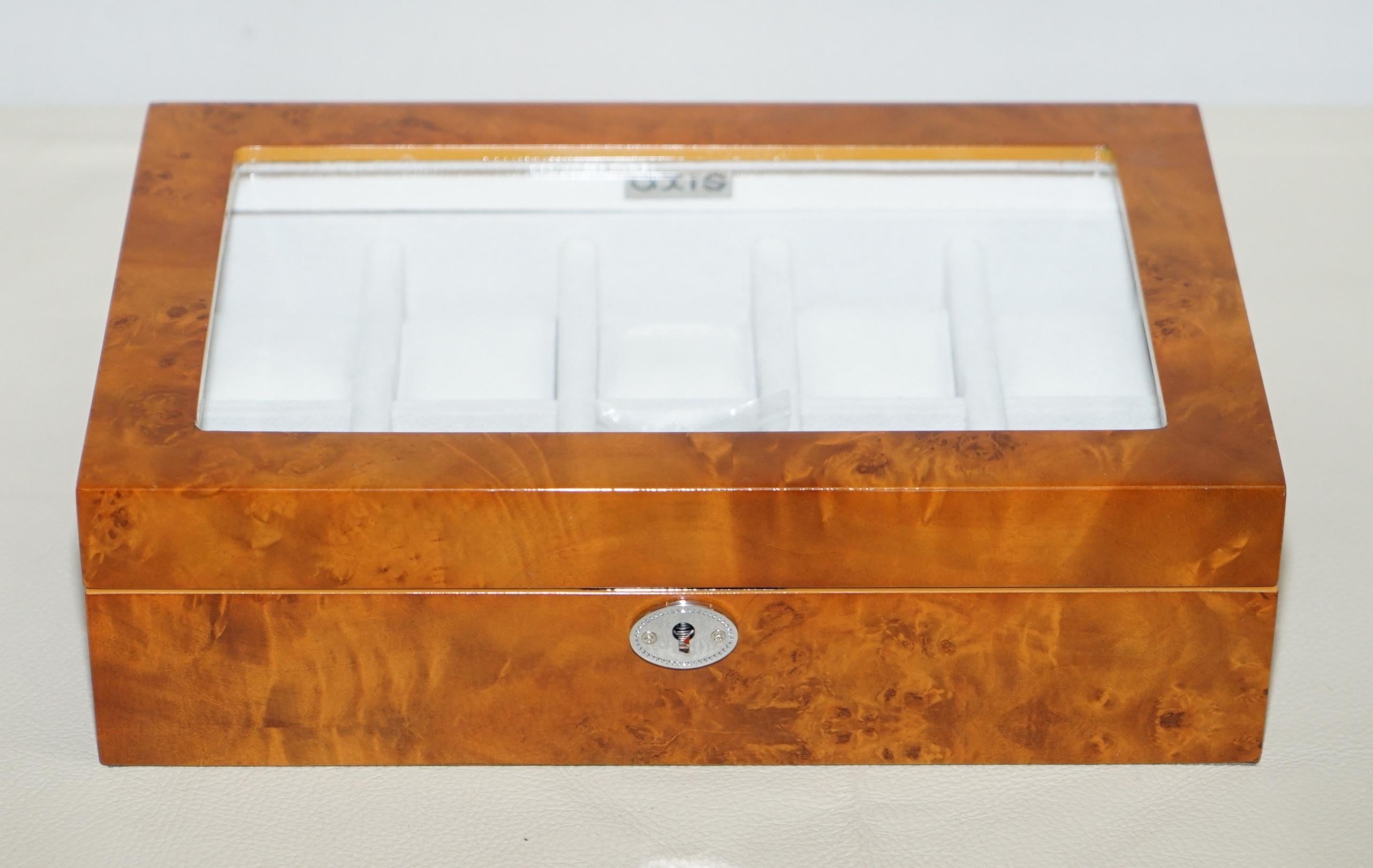 We are delighted to offer for sale this brand new burr walnut watch display case

This was a very generous unwanted gift, all my watches are in the bank!

It can hold 10 watches in style and luxury, the case is lockable

Dimensions:

Height