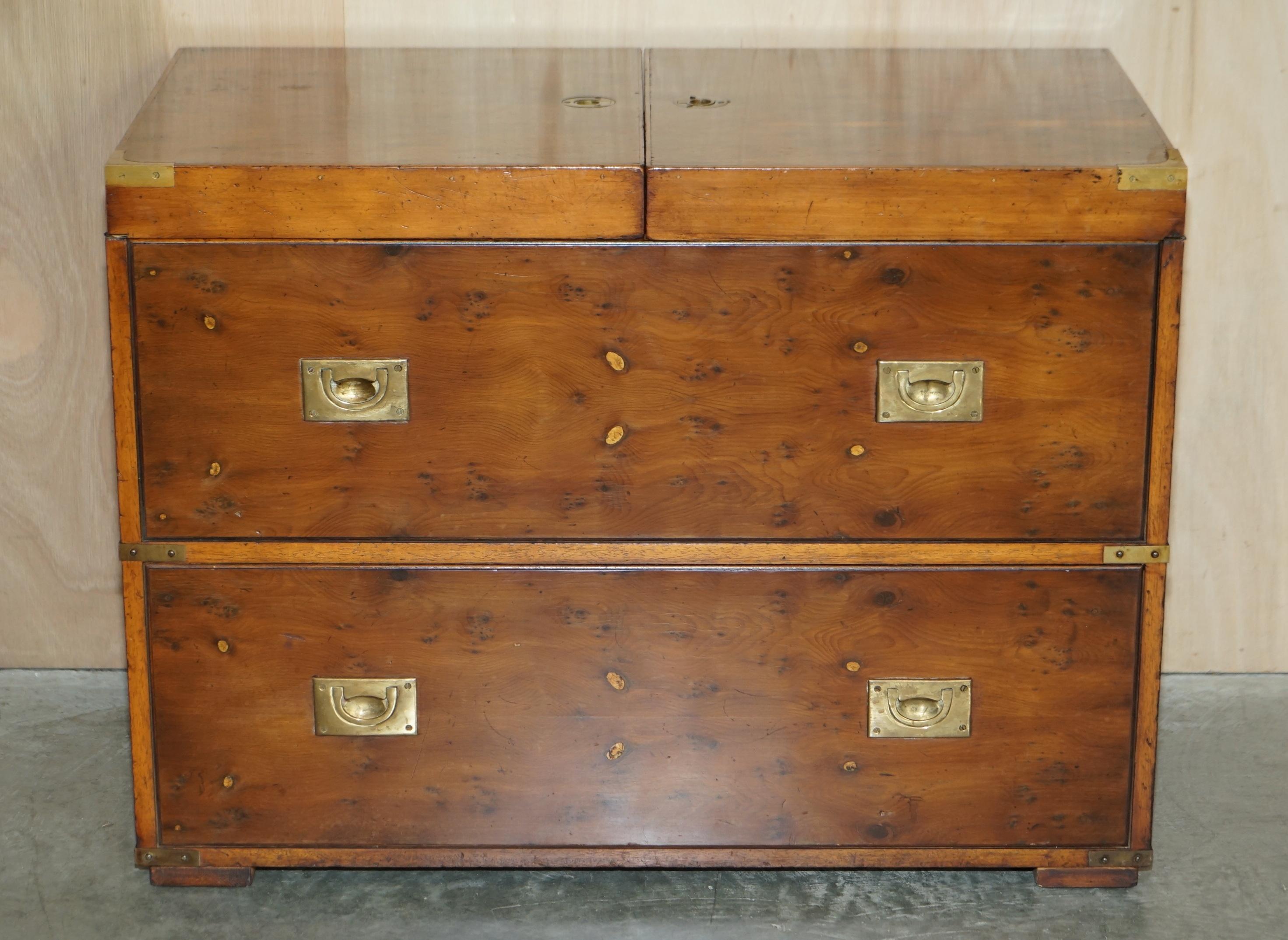 We are delighted to offer for sale this stunning Burr yew wood military campaign chest of drawers which houses a drinks cabinet

A very good looking well made and decorative piece, the drawers are faux and the whole piece is designed to house your