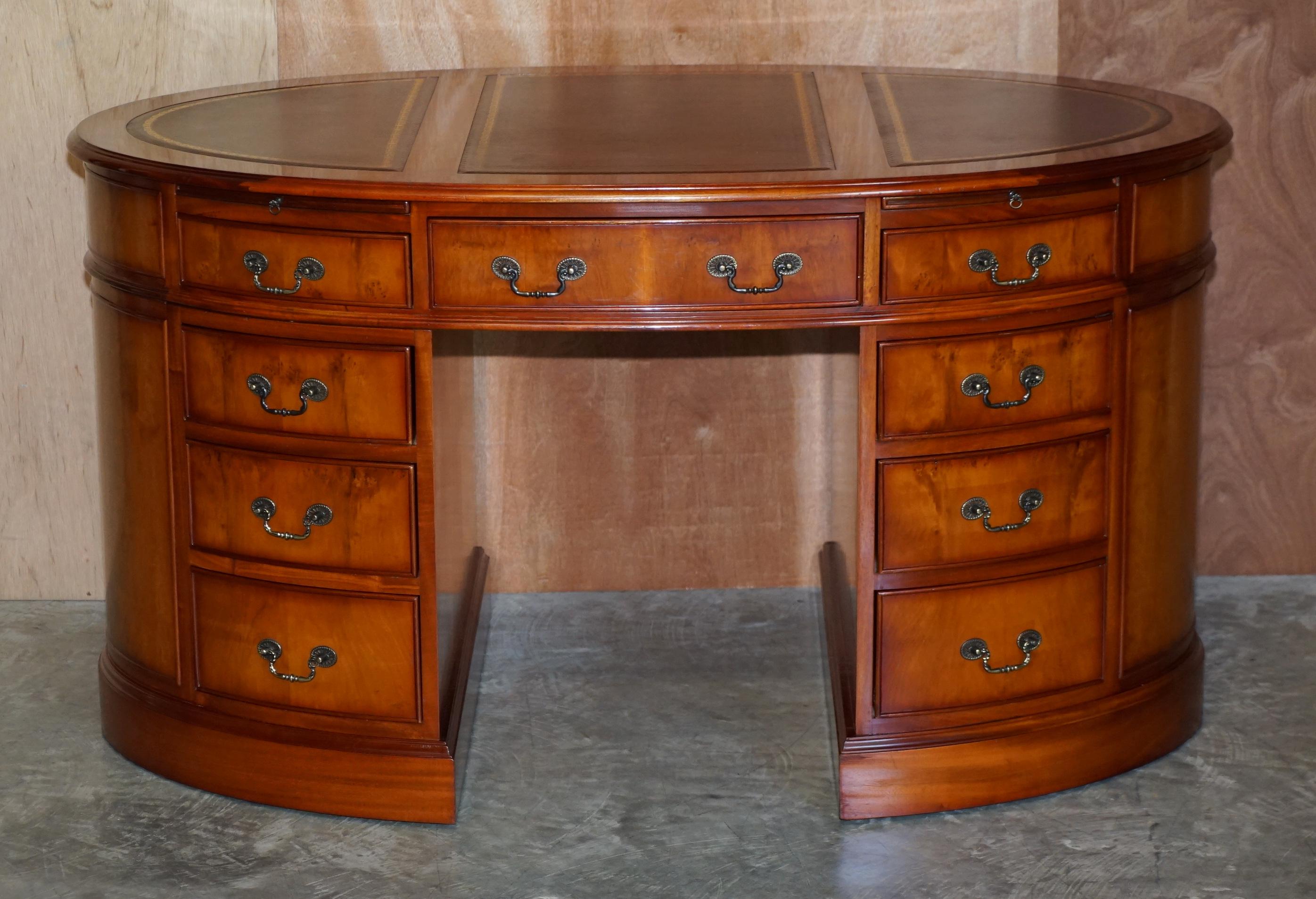 We are delighted to offer for sale this lovely burr yew wood oval pedestal partner desk with split panel oxblood leather writing surface and twin butlers serving trays 

A good looking and decorative desk. In the world of bog standard partner