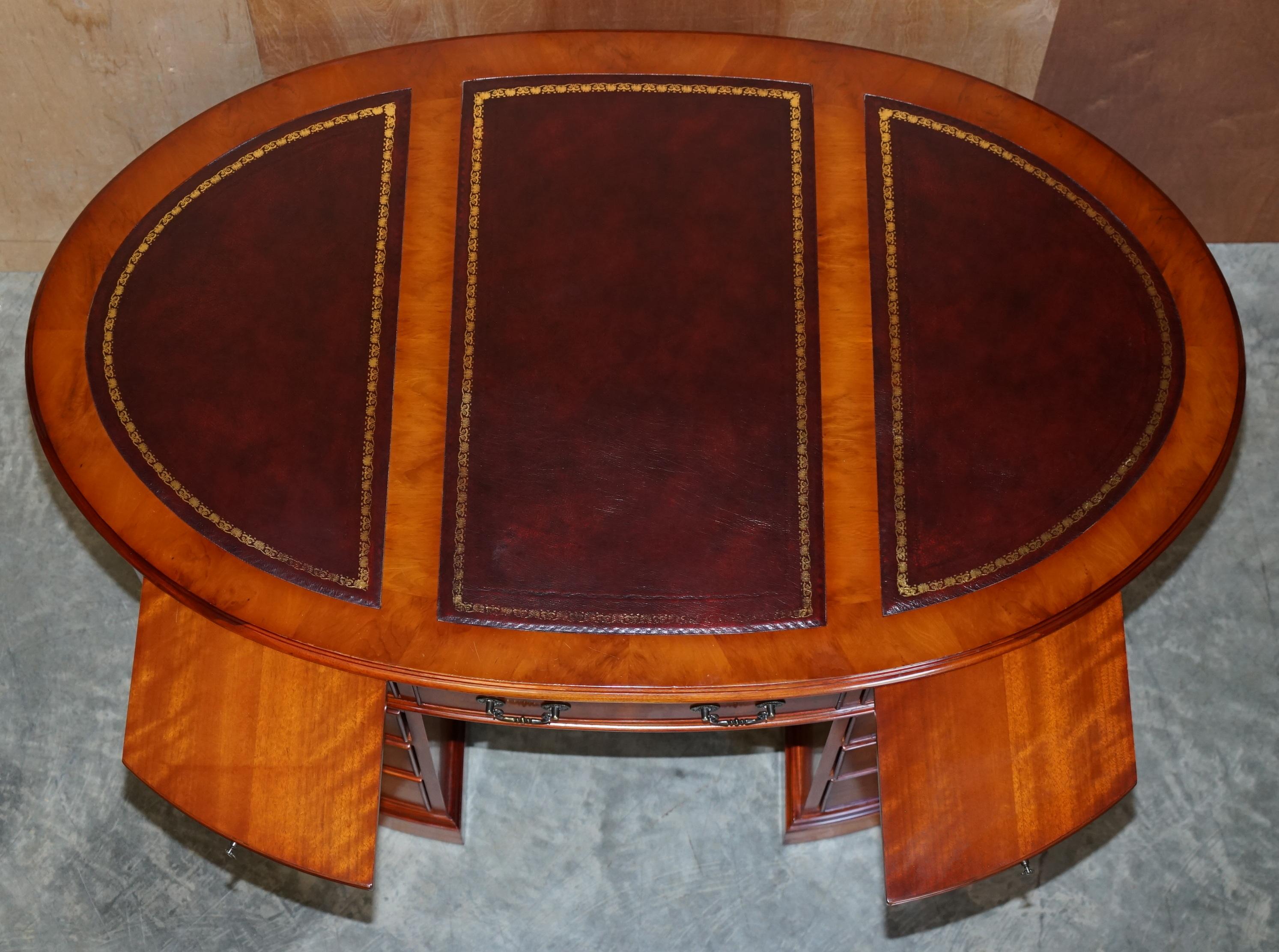 20th Century Burr Yew Wood Oval Pedestal Partners Desk Oxblood Leather Top Butlers Trays