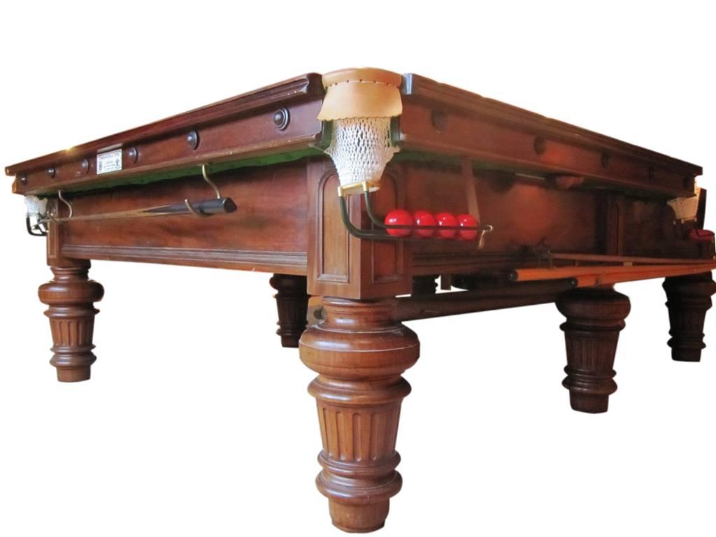 Burroughes and watts snooker table.
A very attractive antique full size snooker table originally manufactured by Burroughes & Watts, circa 1910. The table is mahogany and incorporates good solid turned legs. The playing surface is a slate bed