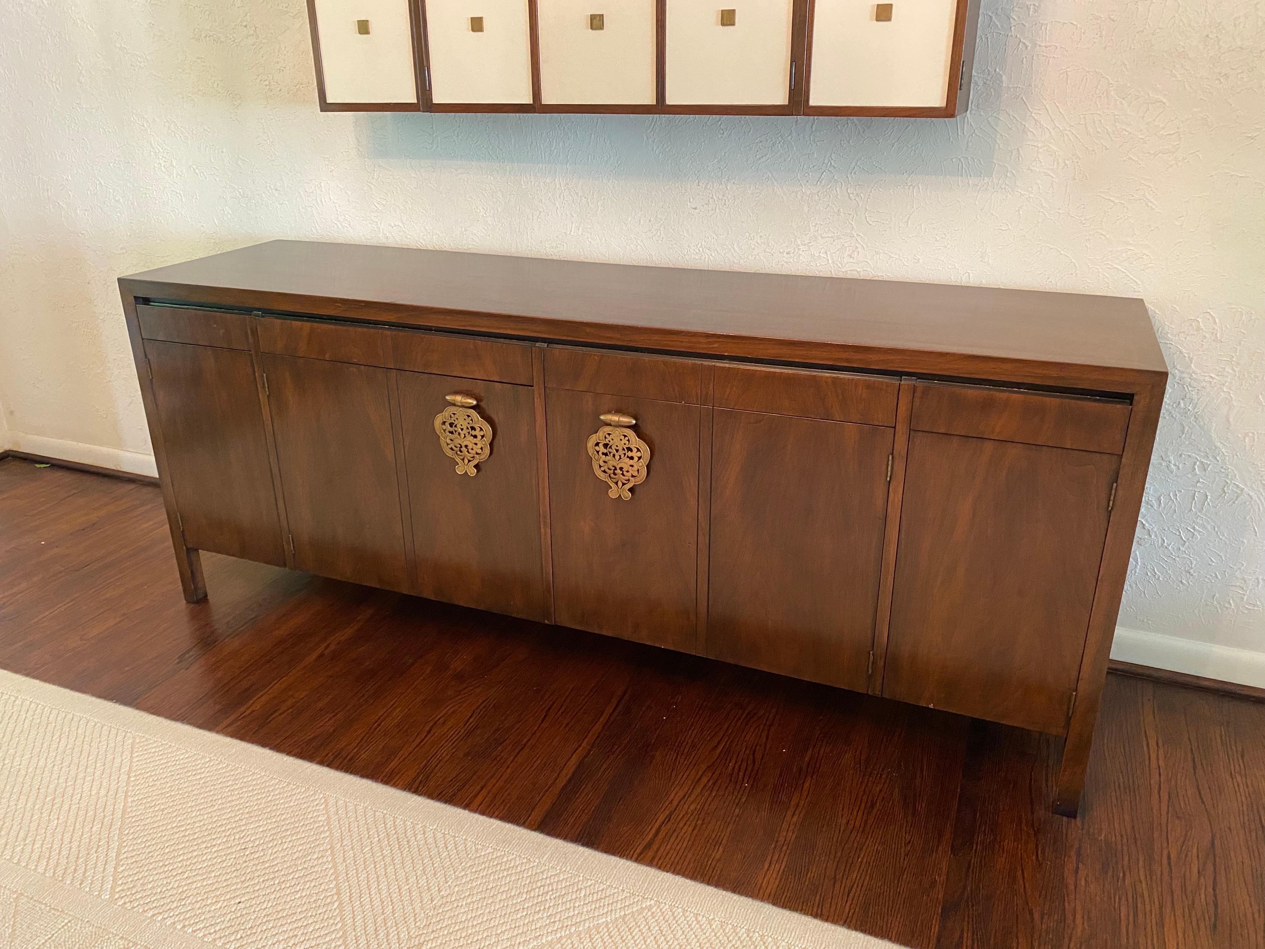 Bert England for Johnson Furniture Company Asian Inspired Buffet/ Credenza.  Walnut with giant oversized hanging handles.  In very nice Original condition.  Bought from the Original Owners, never moved until now.  Other pieces from the series listed
