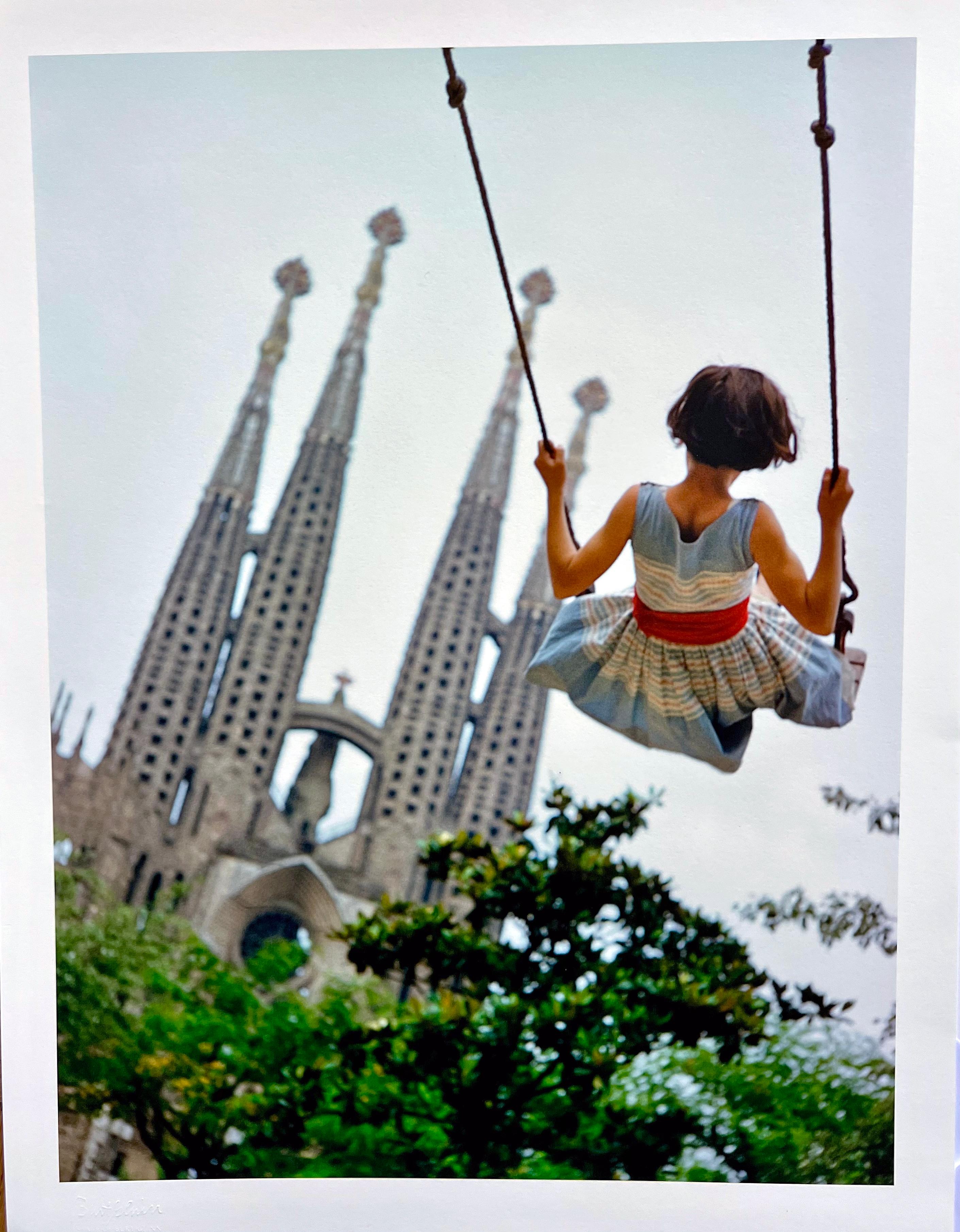 Burt Glinn Portrait Photograph - Swing, Color Photography of Young Girl at the Gaudi Cathedral Barcelona, Spain