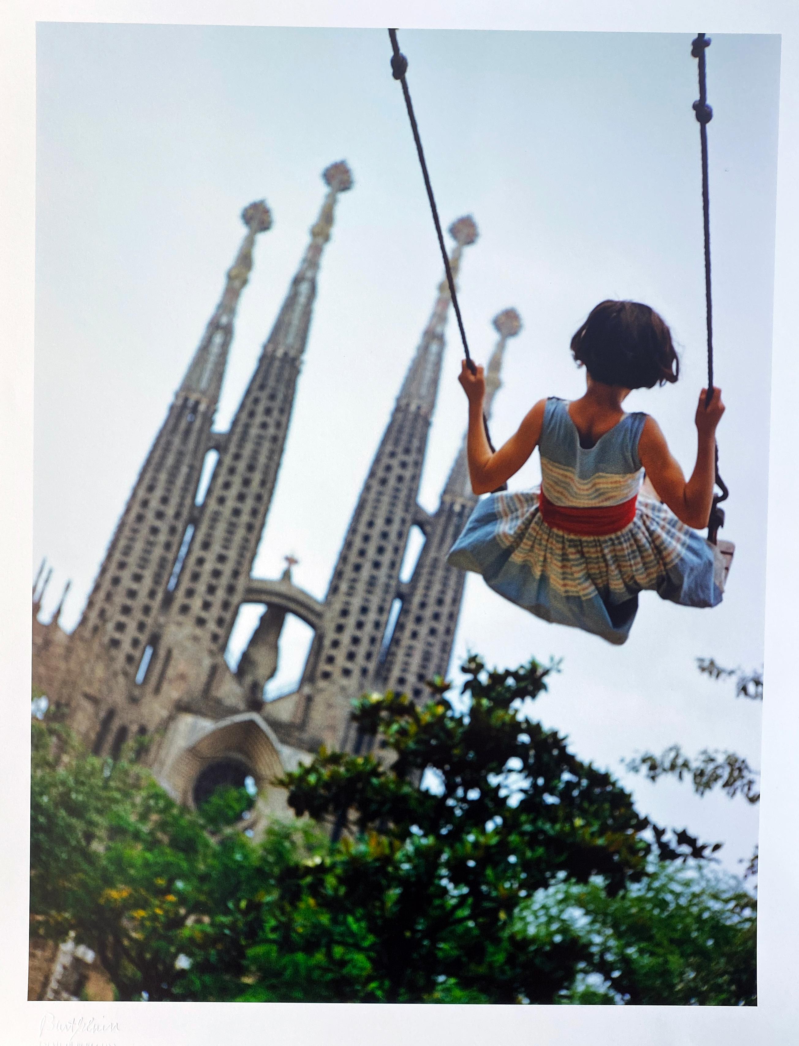 Burt Glinn Color Photograph - Swing, Color Portrait Photography Child and Gaudi Cathedral Barcelona, Spain