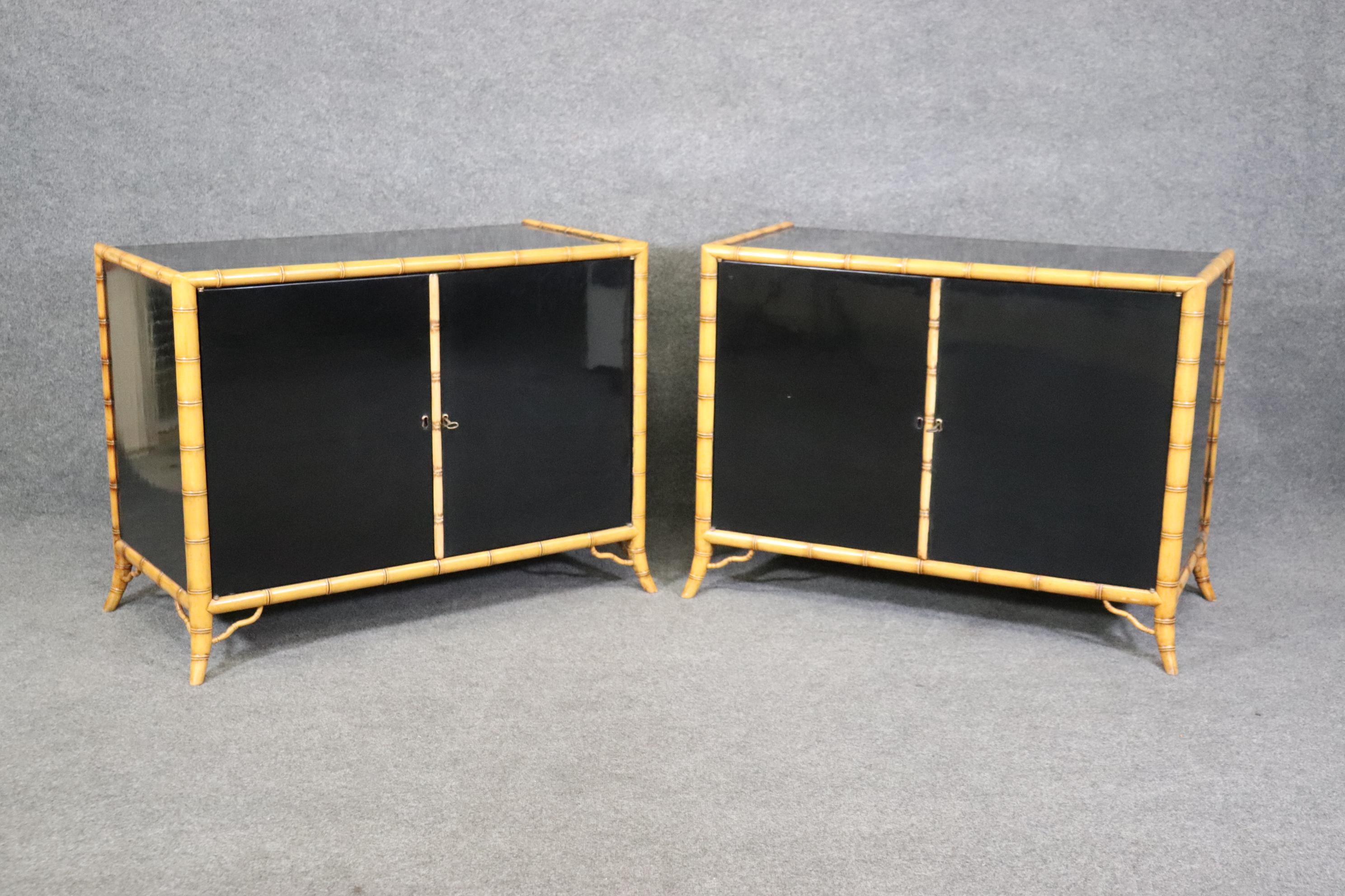 This is a stunning pair of faux bamboo commodes done in a natural looking faux bamboo with polished black lacquer tops and sides. The construction quality of Burton-Ching items are ALWAYS top notch and no expense is spared to make them look 